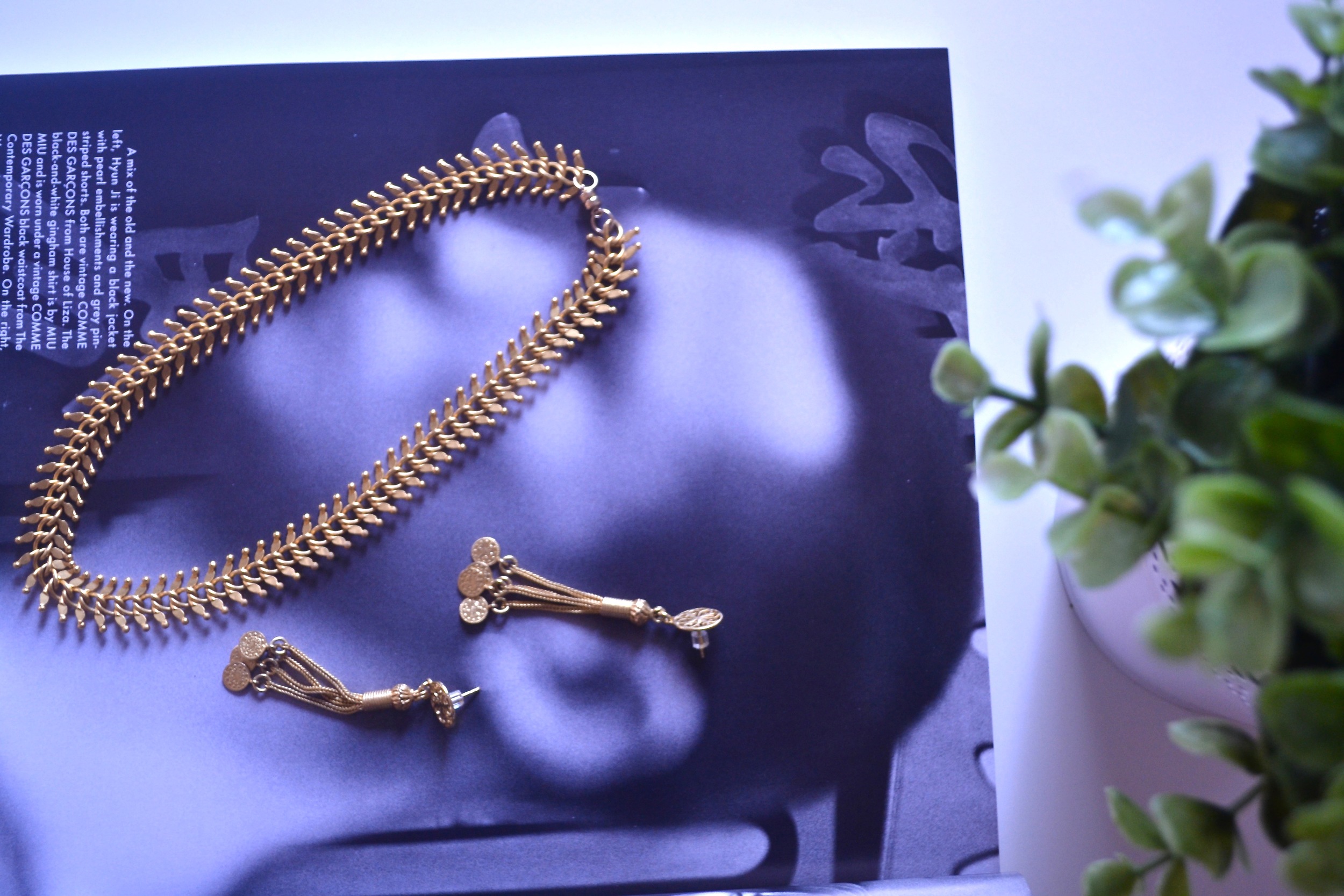 Pictured: Kantara Fish Bone choker, Mindi Gold Snake Chain Tassel Earrings