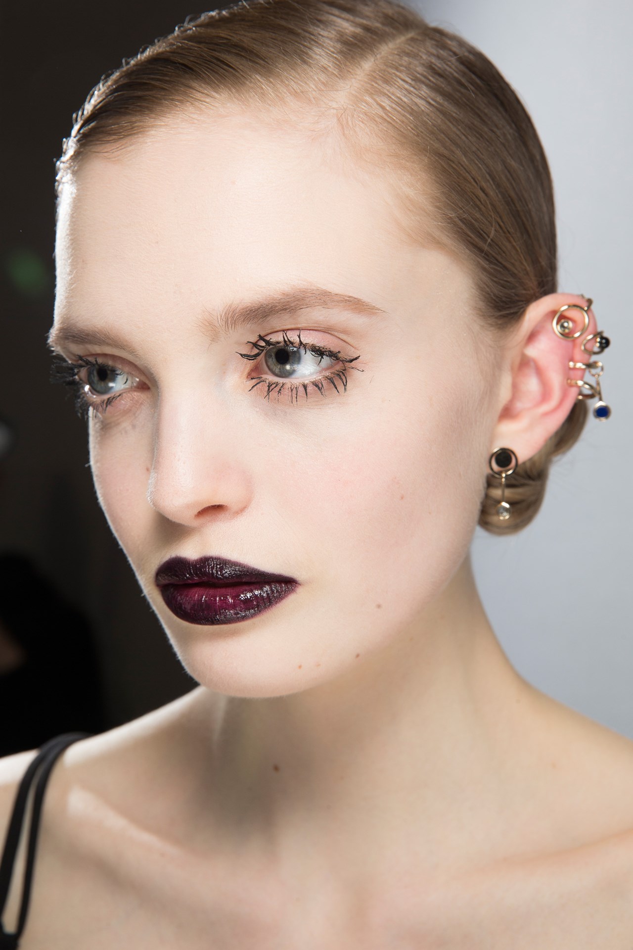 Christian Dior - For hair, Guido Palau created deep, neat side partings, slicking the hair close to the head.
