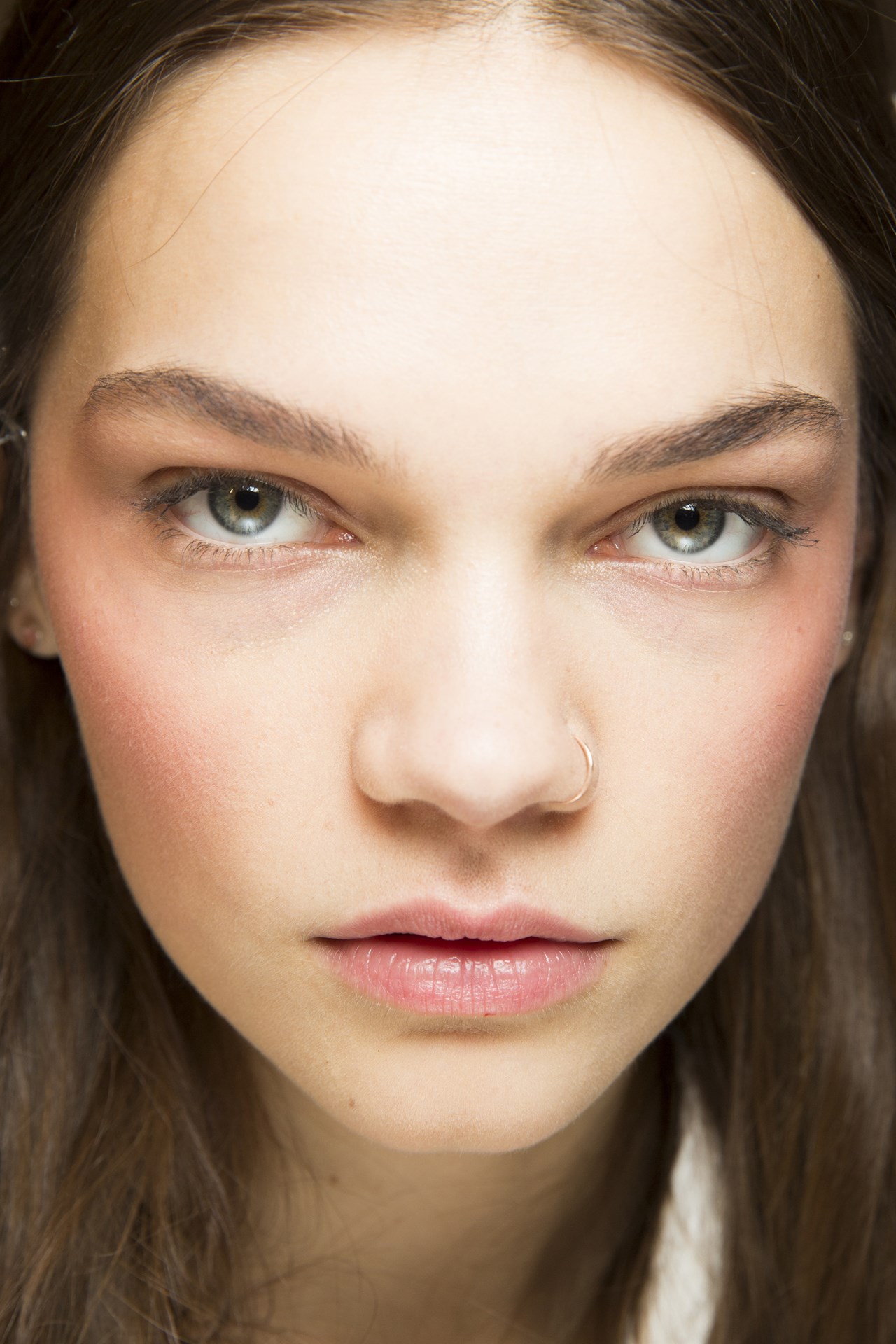 Gucci - Pat McGrath created an ethereal look at Gucci, buffing a coral hue onto the high points of the cheekbones for a new take on blush.