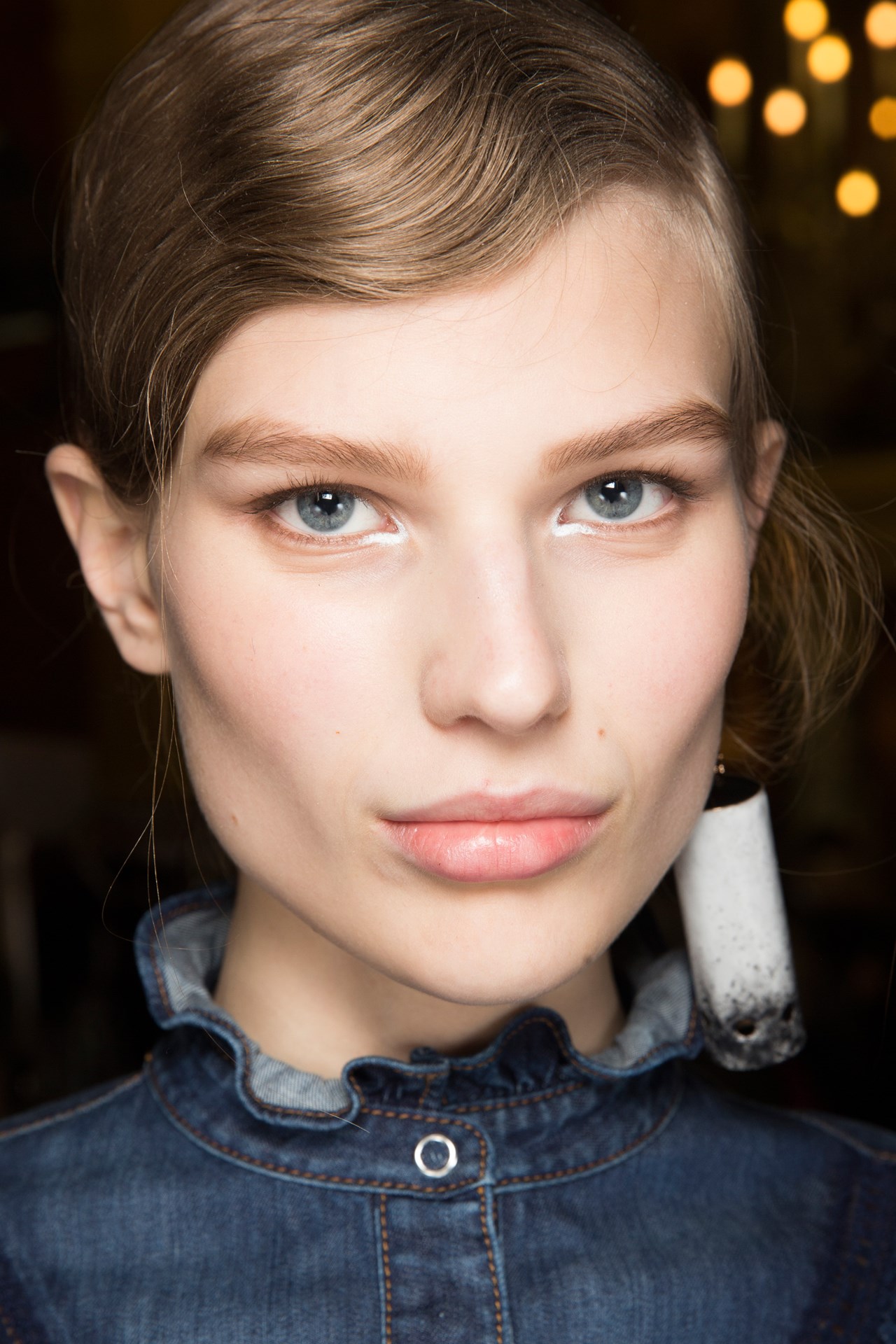 Stella McCartney -A subtle "V" of white eyeliner at the inner corner of the eyes completed Pat McGrath's minimalist beauty look at Stella McCartney.