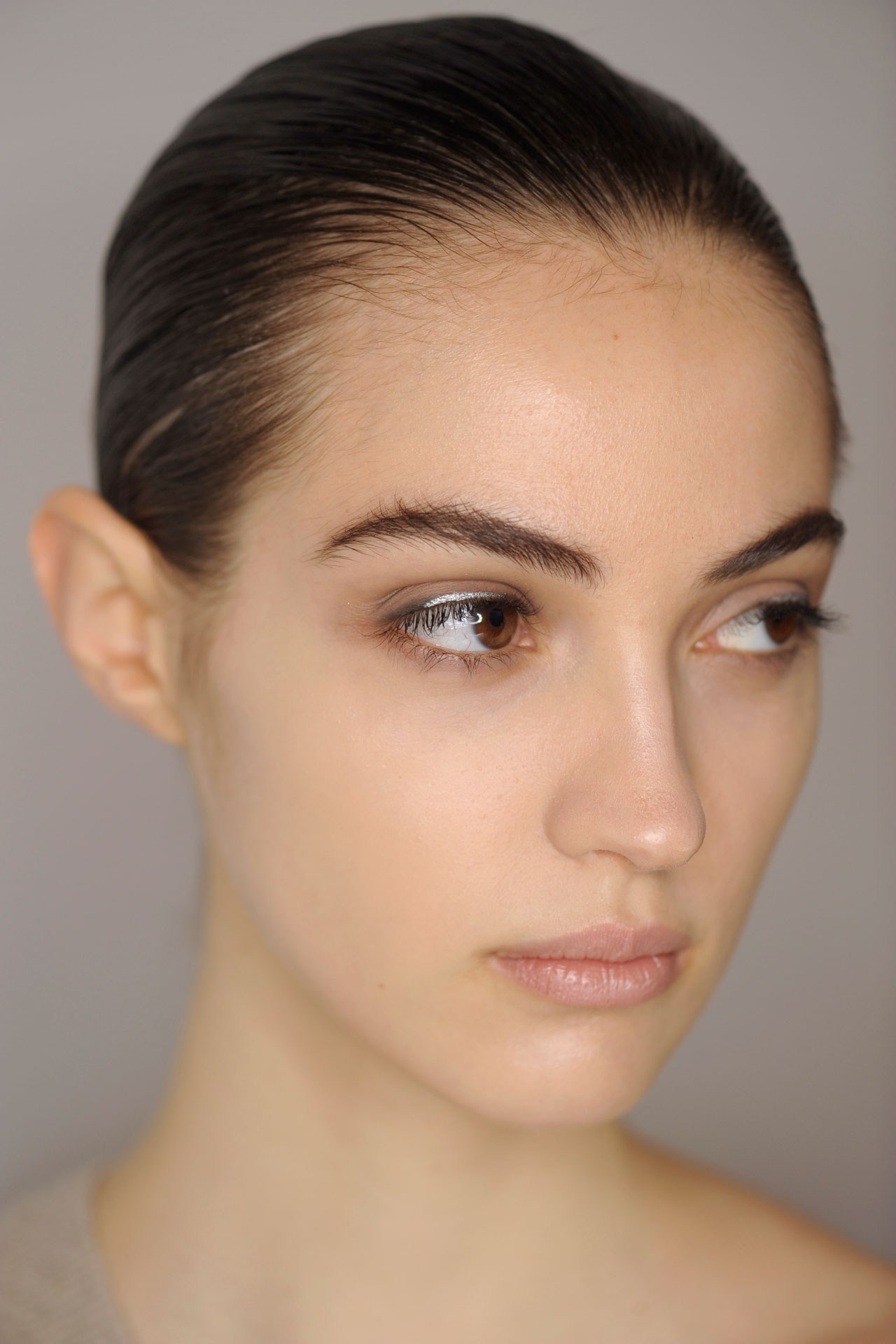 Jil Sander - Lisa Eldridge kept models' skin fresh at Jil Sander, with grey-lined eyes offset by a flash of silver.