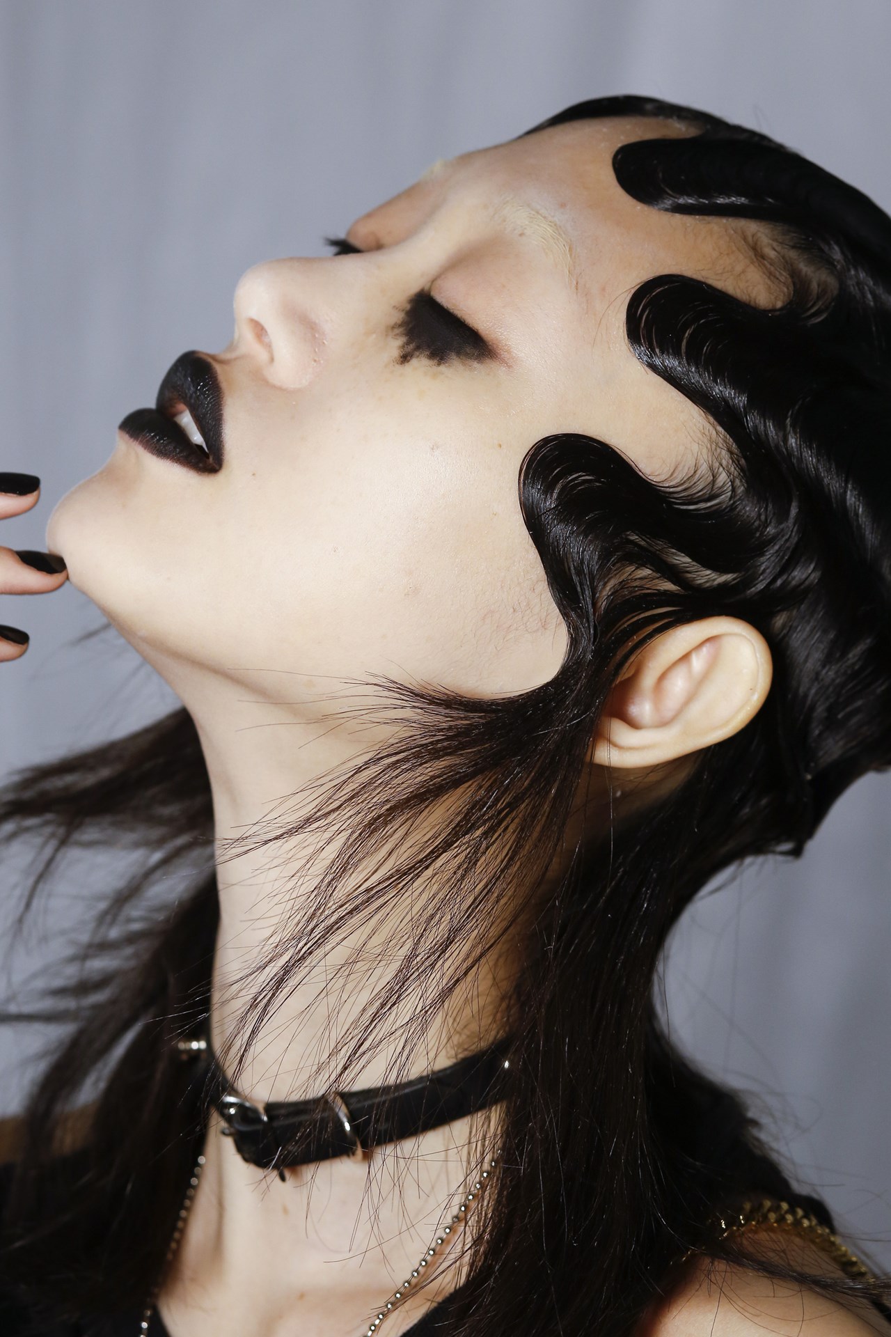 Marc Jacobs - Guido Palau created slick and precise finger waves worn close to models' heads, whilst the lengths of their hair were left tousled and casual.