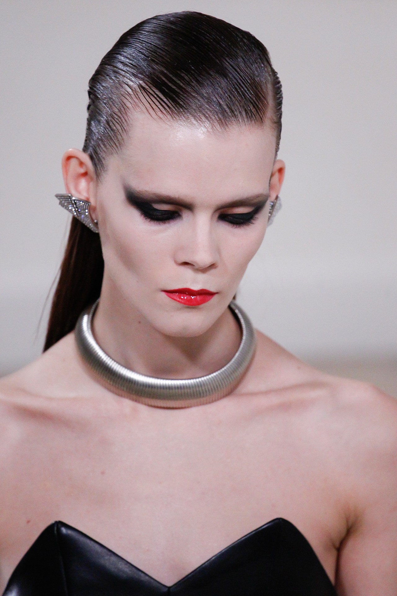 Saint Laurent - Hair, by Didier Malige, was parted low on one side and slicked back to leave hair loose down models' backs.