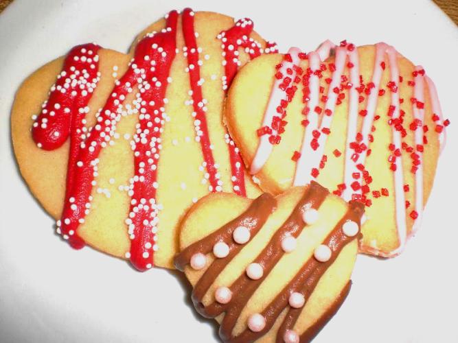 Cream Cheese Sugar Cookies cut into heart shapes for Valentines Day. Yummy, perfect dough for any cut-out cookie!