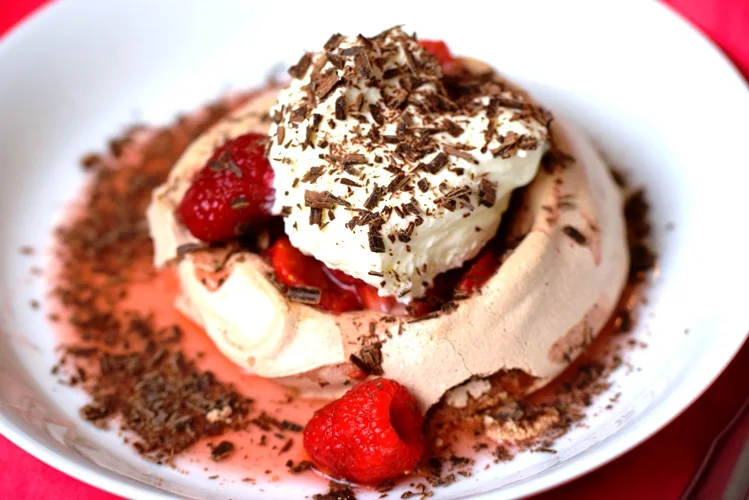 Individual Chocolate Pavlovas with Berries, Whipped Cream & Shaved Chocolate