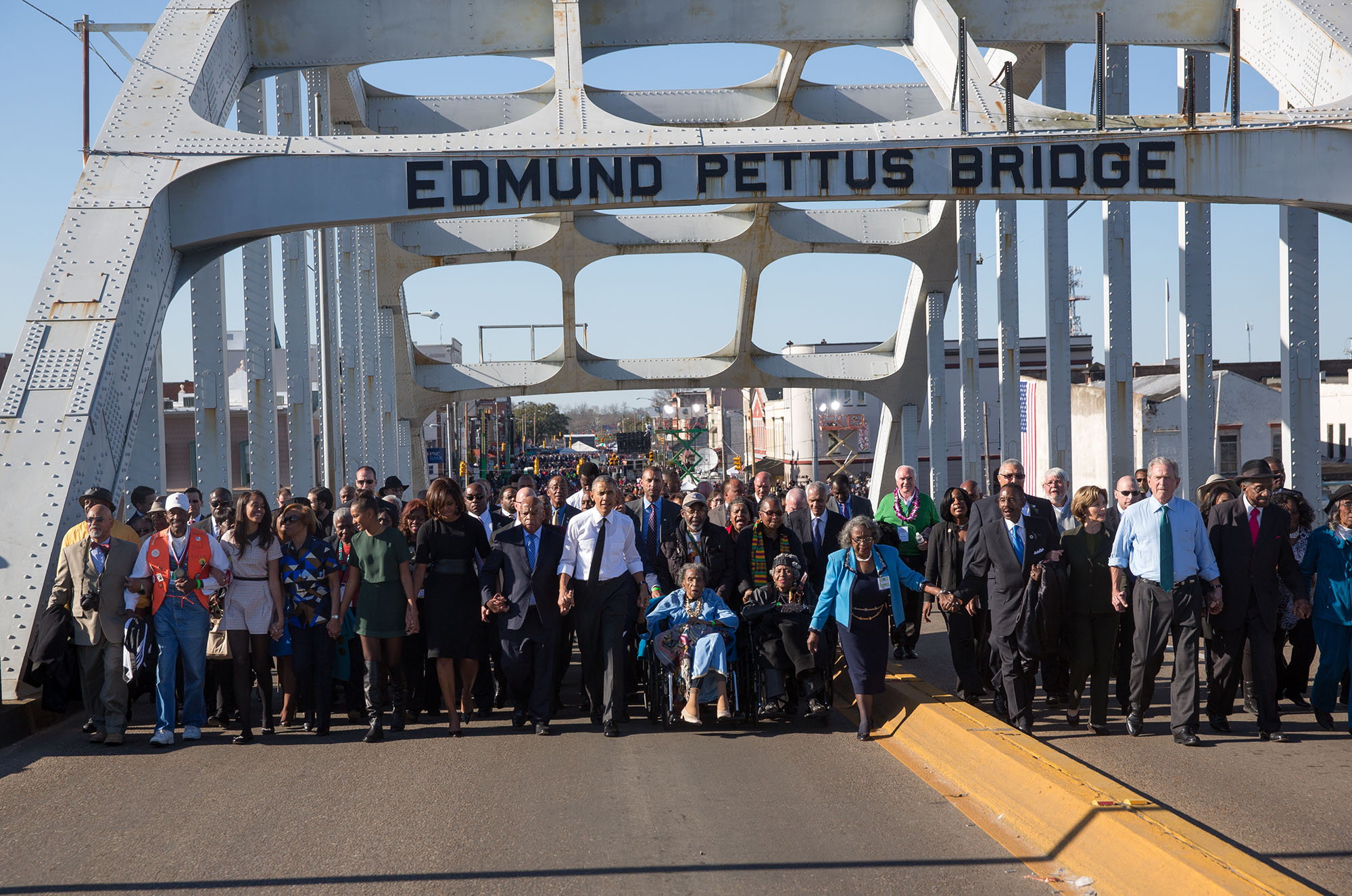 " The Obamas and the Bushes continue across the bridge " Official White House Photo by Lawrence Jackson.