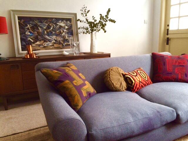 African cushion sitting well in this uber gorgeous sitting room.