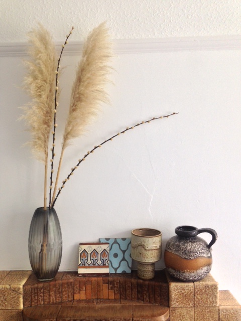 Tiles I purchased on my trip, one very old and one not so old, sitting well next to the mid-century pottery and smokey vase.