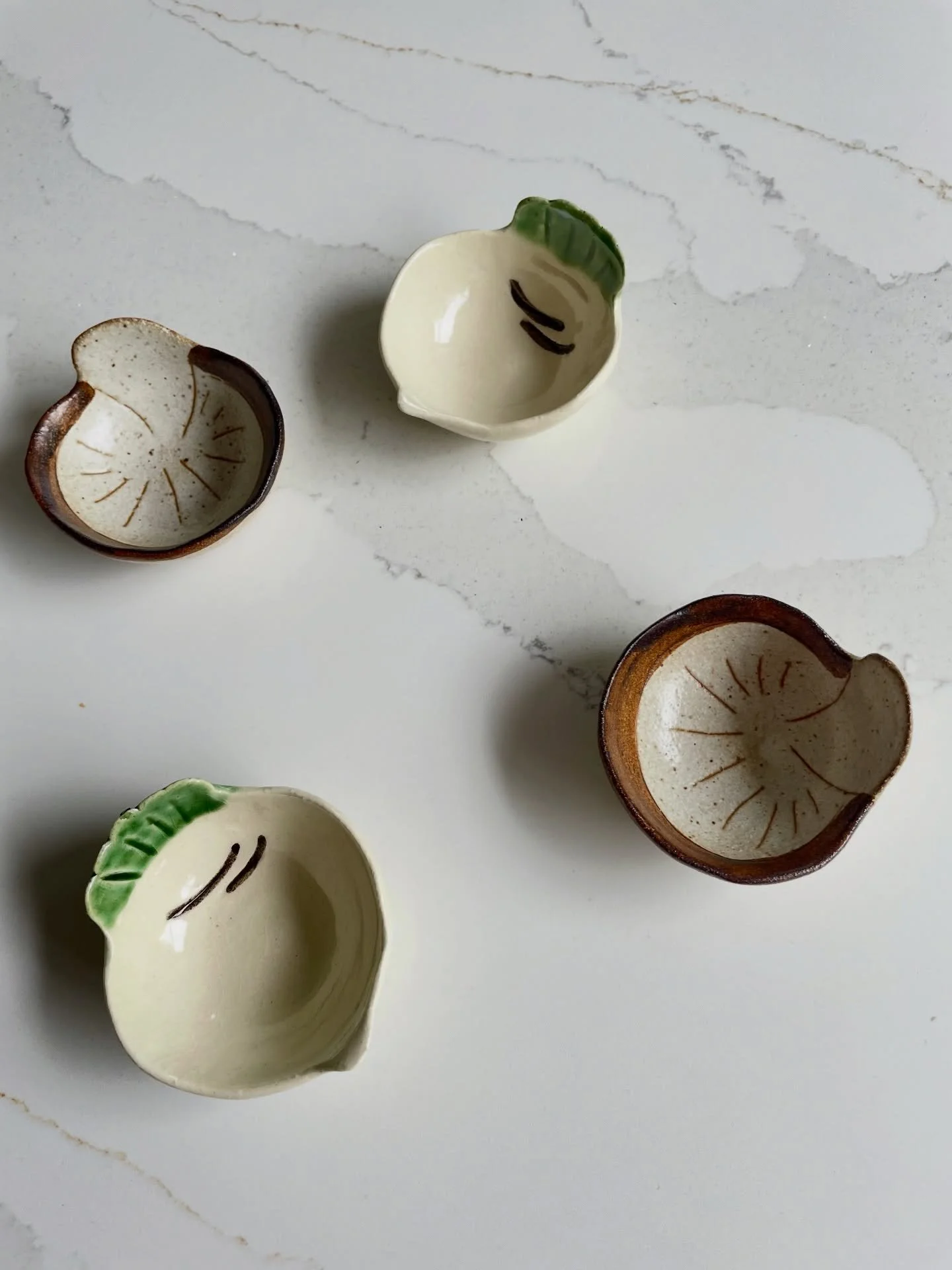 Hand formed and glazed by Japanese artisans, these mini dishes shaped like vegetables are a fun addition to a summer tablescape. Fill with soy, wasabi or small berries, they work equally well holding your precious jewellery. Available in New In.