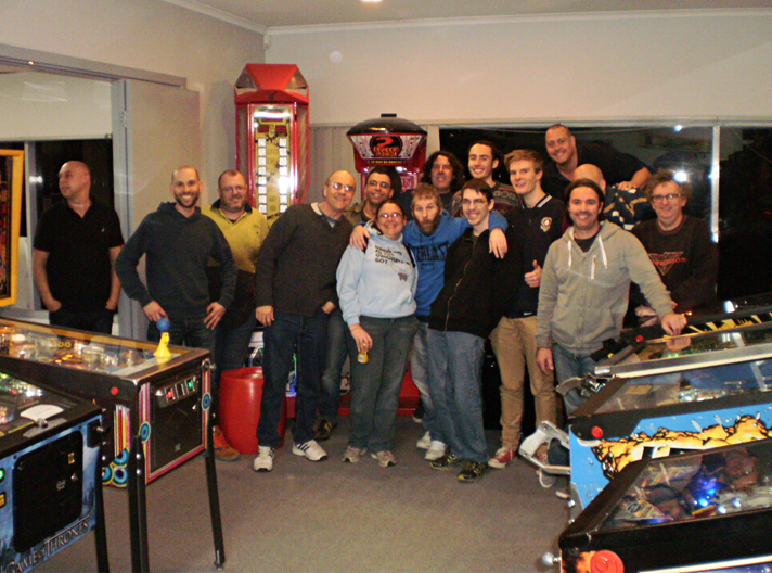 At the end of the night this group photo was taken. It includes 13 of the finalists (Chris Craft was an apology & Vincent Rossis had left). From left to right; Stephen Vari (Amusement Worx), Michael Costalos, Robert Macauley (winner), Paul Michell (Tournament Director), George Choimes, Amity Wells (scorer), Wayne White, Tim Freedman, Sean Olley, Matthew Owen (runner-up), Tom Casey, Andrew Heitmann, Lou Martire, Grant Stephens (obscured) and Gary Regan. Photo courtesy Simon Wisbey, Amusement Worx .