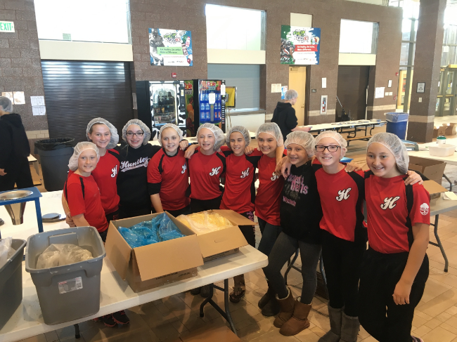 The 12U Red team volunteered in November 2015 to pack meals that were shipped all over the world to aid in Feed My Starving Children's cause.