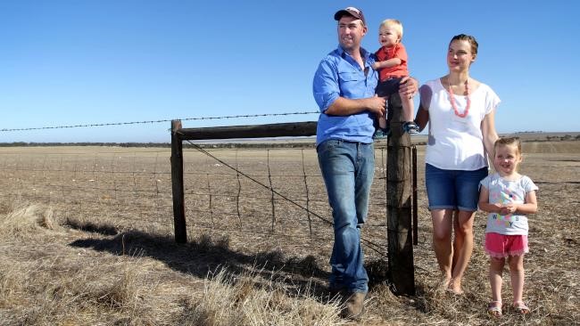 Wheat farmer Andrew Baldock with wife Dale and children Lucy and Jack on their Kimba property, proposed site of a nuclear waste dump. Picture: Kelly Barnes