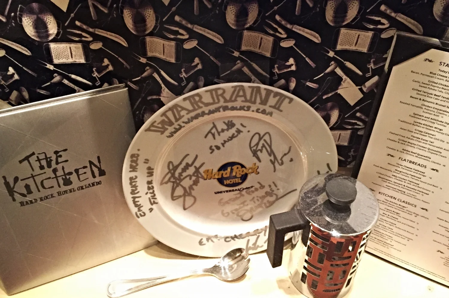 Window display featuring Warrant memorbillia at The Kitchen.