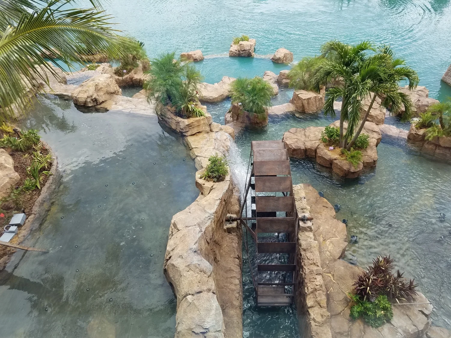 Looking Down on the Water Wheel at Loews Sapphire Falls Resort