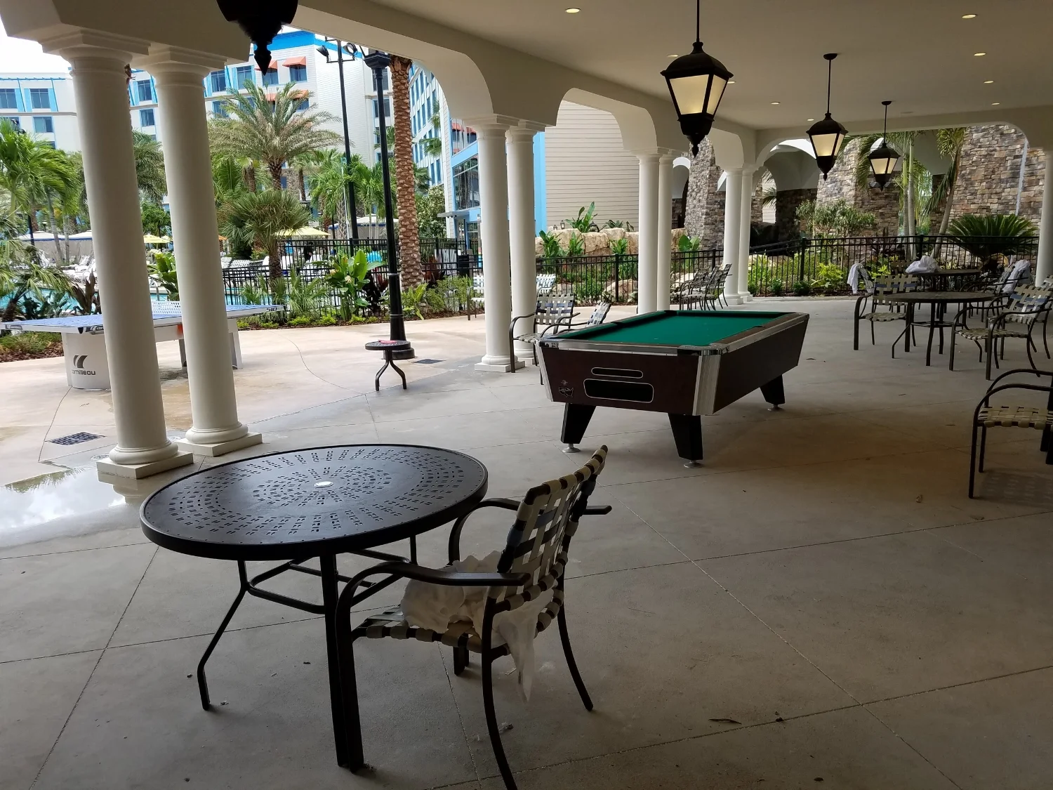 Covered Seating Area Near the Pool at Loews Sapphire Falls Resort