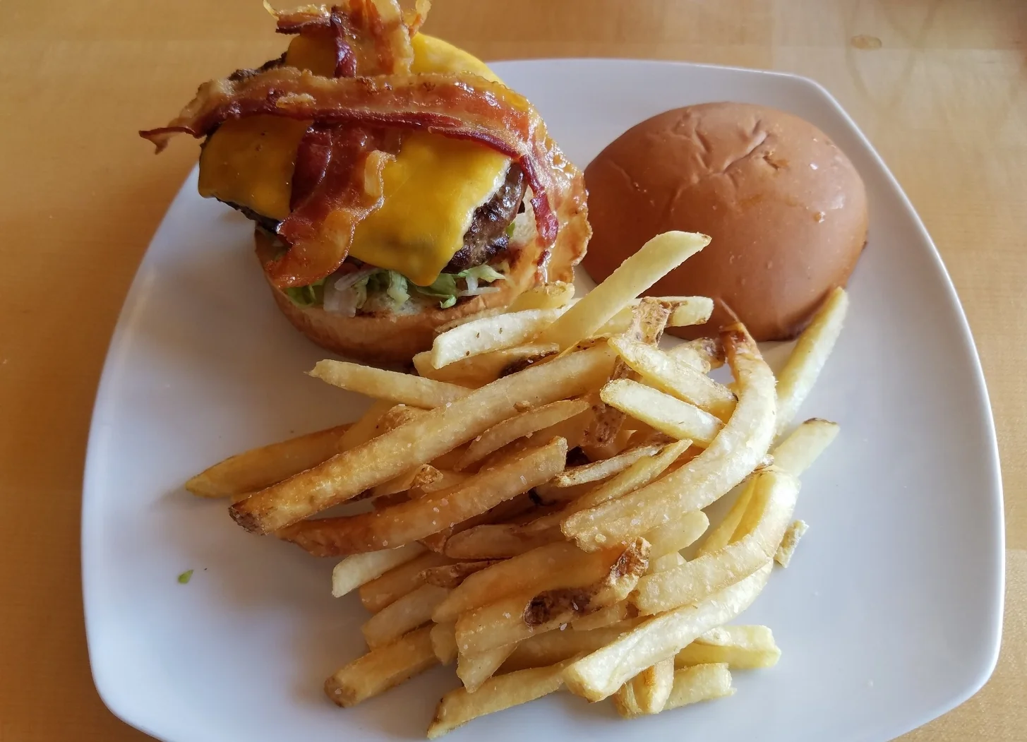 The Traditional Hamburger with French fries at Mythos Restaurant.