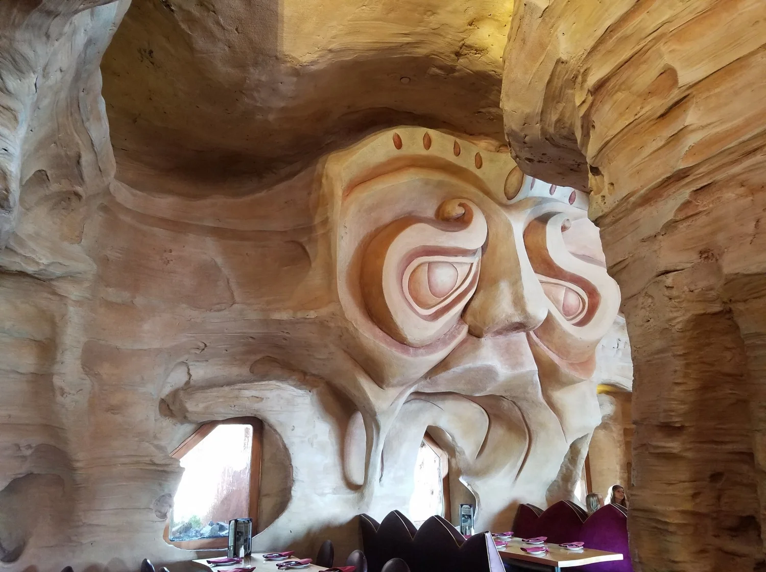 One of the brother kings of the seas carved into the interior of Mythos Restaurant.
