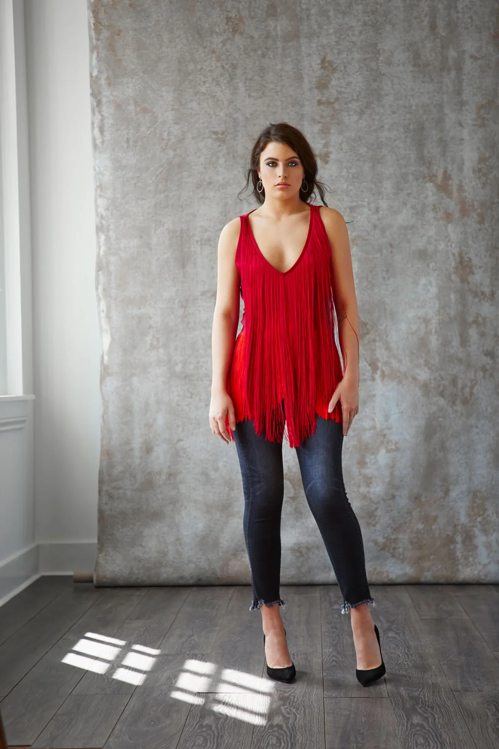 Stella McCartney fringe top, Mother Denim jeans, Jimmy Choo pumps