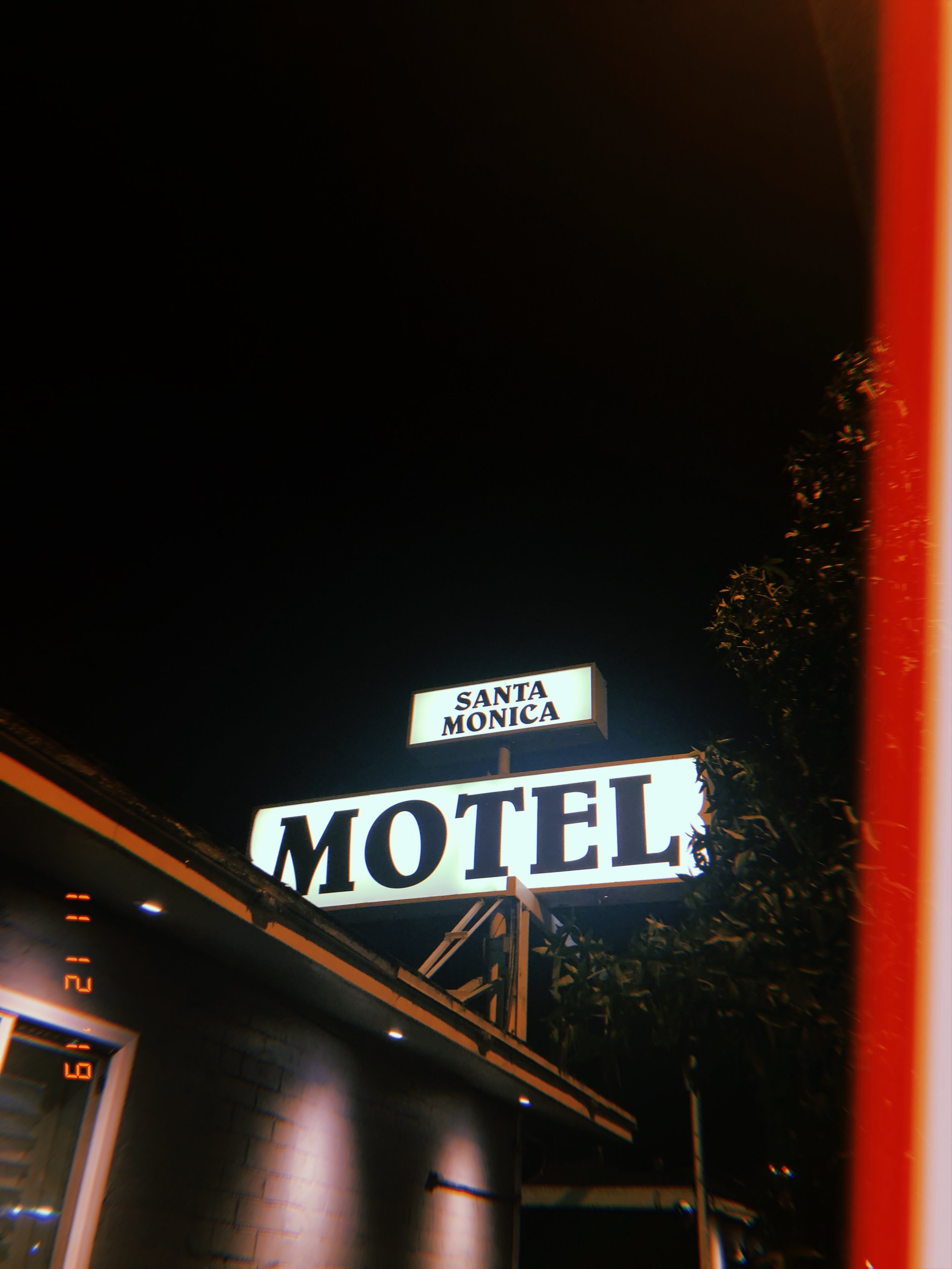 Santa Monica motel neon sign glowing at night.JPG