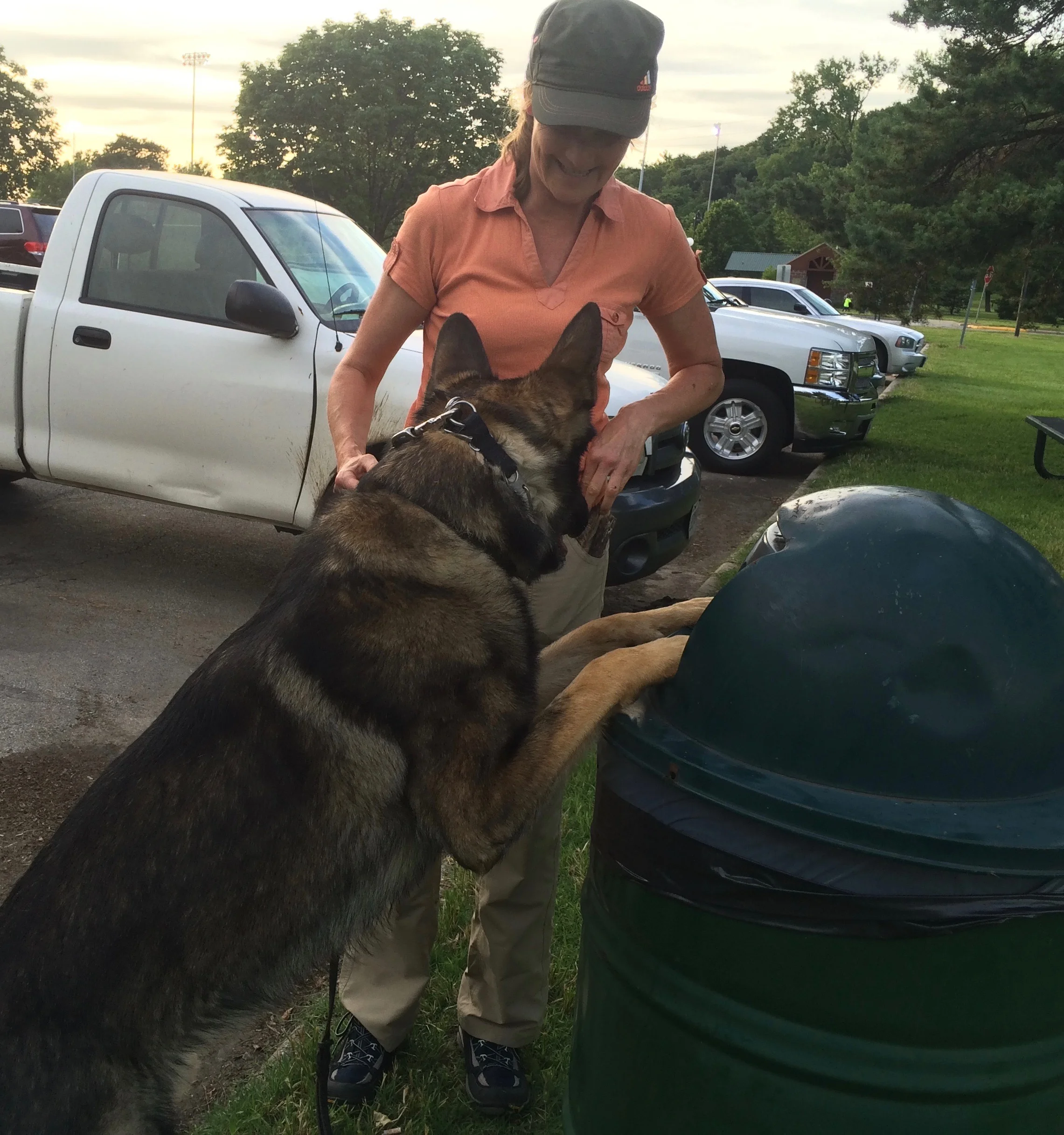 Darla Lilly assists Gregg as he clears the park of trash.