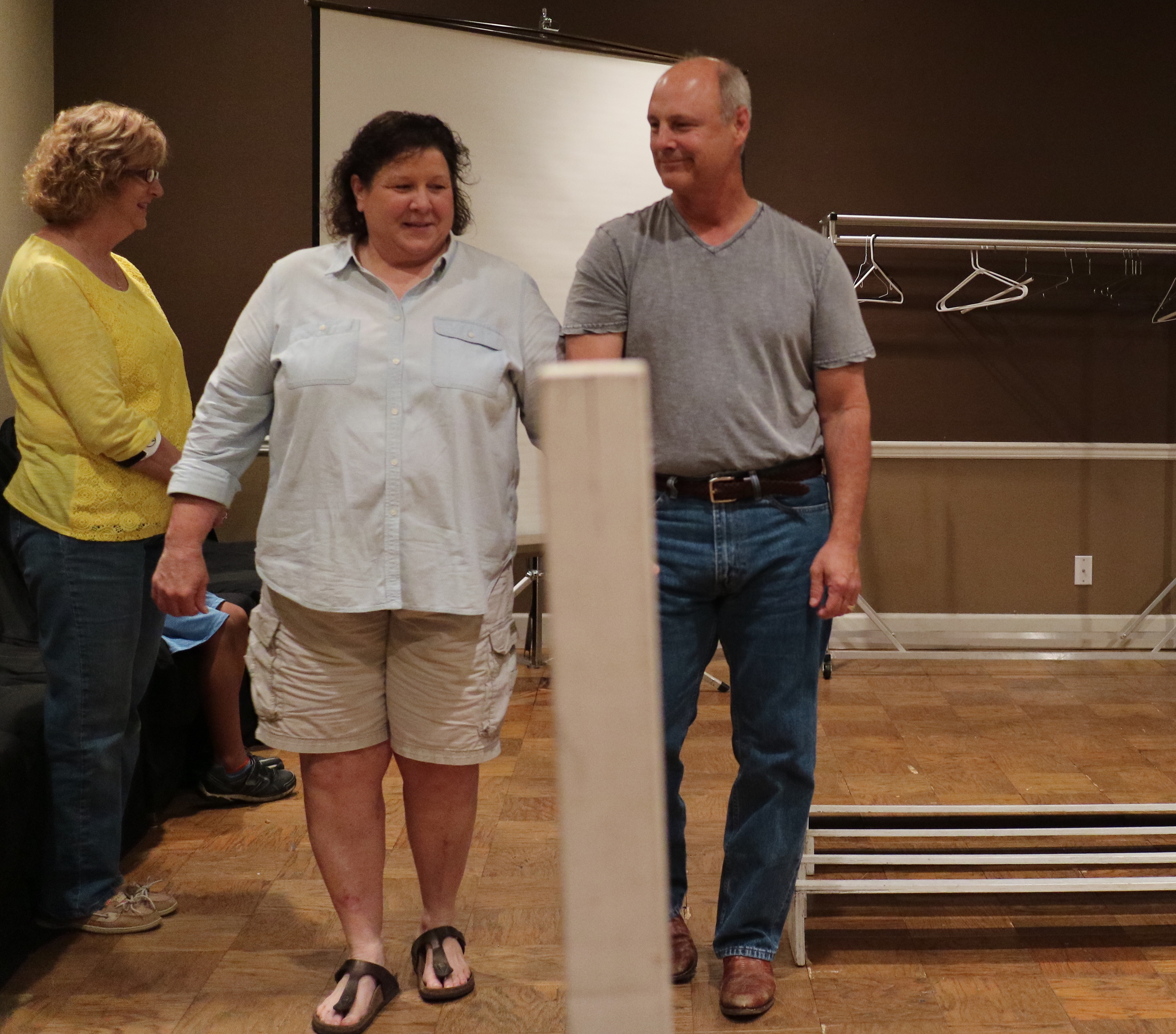 Above, Marion Baker portrays a ring steward, with Carmi Swift as an exhibitor, and Bill Long as a competition obedience dog.