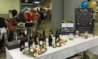 The table for the Wine Pull fundraiser at the Topeka shows was in a prominent location so everyone who walked into the show building had a chance to see it. The club raised $340 to donate to the Heartland Police Canine Training and Trials. The Wine Pull was the brainchild of Carmi Swift , who chaired the effort along with Tiffany Bartley.
