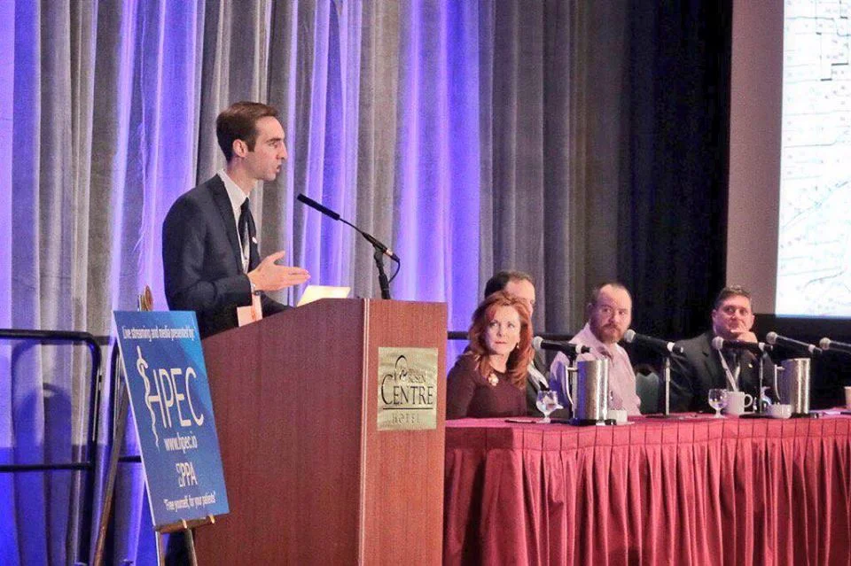 At the podium, sharing about passion, purpose, authenticity and caring. — with Chad Savage , Josh Umbehr and Lee S. Gross at Rosen Hotels & Resorts Orlando .