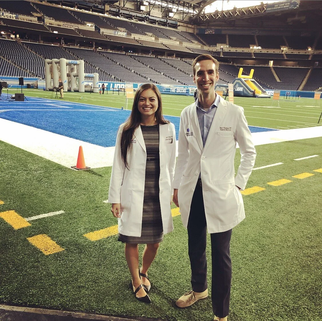 Raquel Orlich, DO and Paul Thomas, MD of Plum Health DPC at the Ford Field Men’s Health Event.