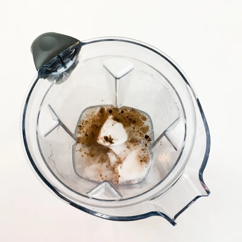 Water and flesh of one young Thai coconut and vanilla powder