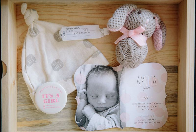 This one doesn't necessarily have to be done within the first month. If you hire a photographer, gather all of the items you'd like photographed such as baby's hospital bracelet or welcome home outfit and have them available. This type of photo can be during those downtimes when you're taking care of baby.