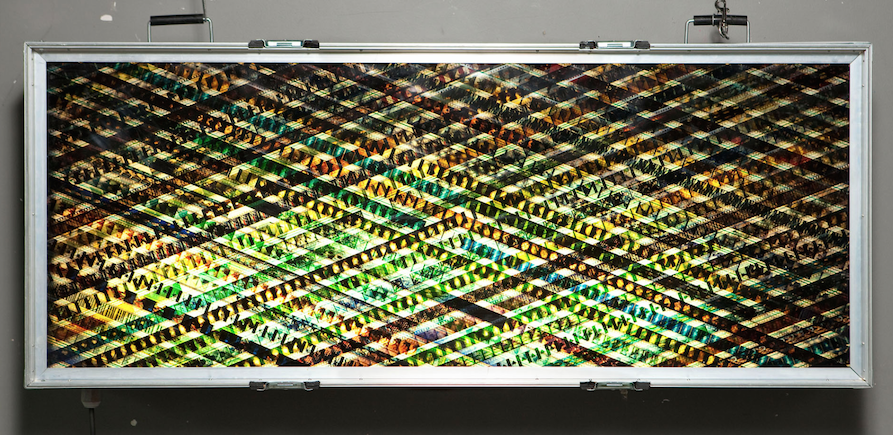 Behold The Message. 35mm Celluloid Film. Fluorescent Lights. Glass. Custom Lightbox. 60x30x8. Richard Kerr. 2004. *Collected by TIFF Film Reference Library.