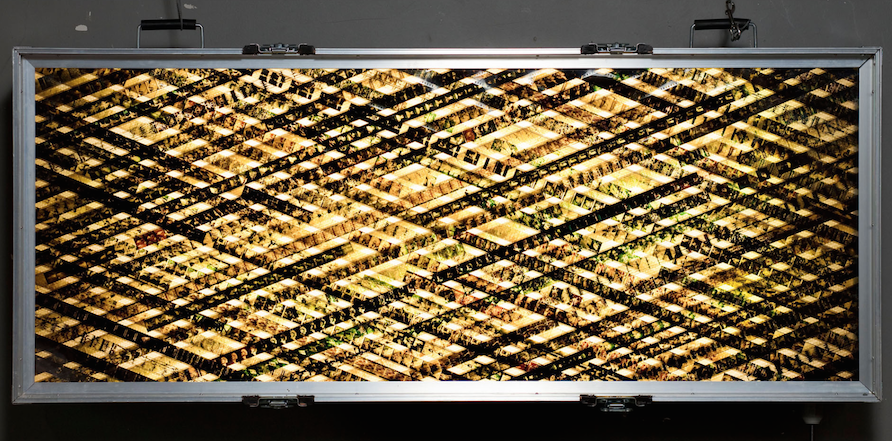 Heaven and Earth are About to Collide. 35mm Celluloid Film. Fluorescent Lights. Glass. Custom Lightbox. 60x30x8. Richard Kerr. 2004. *Collected by TIFF Film Reference Library.