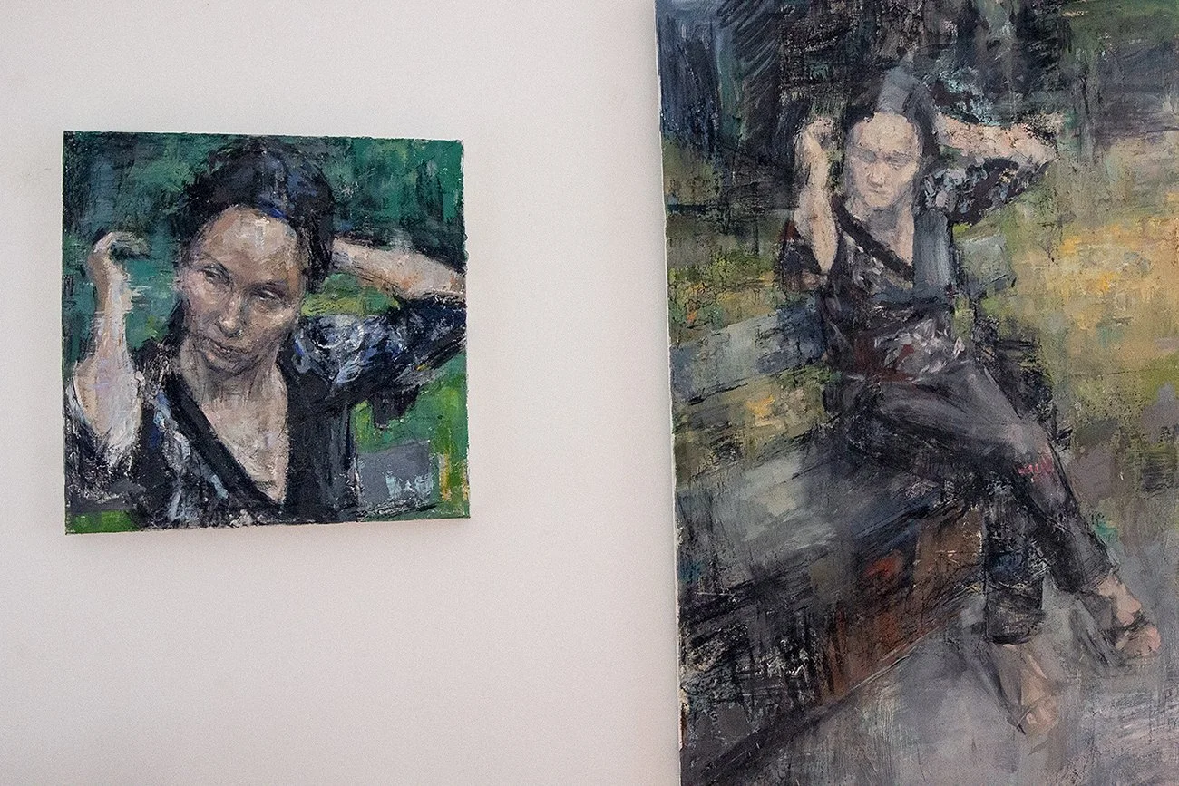 Installation view showing a large-scale painting with a related painted detail from the same series.