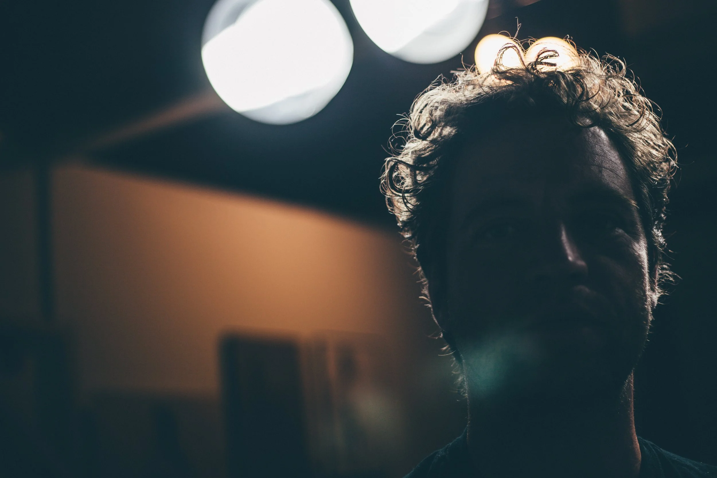 Tibor Simon-Mazula, artist portrait in studio lighting.