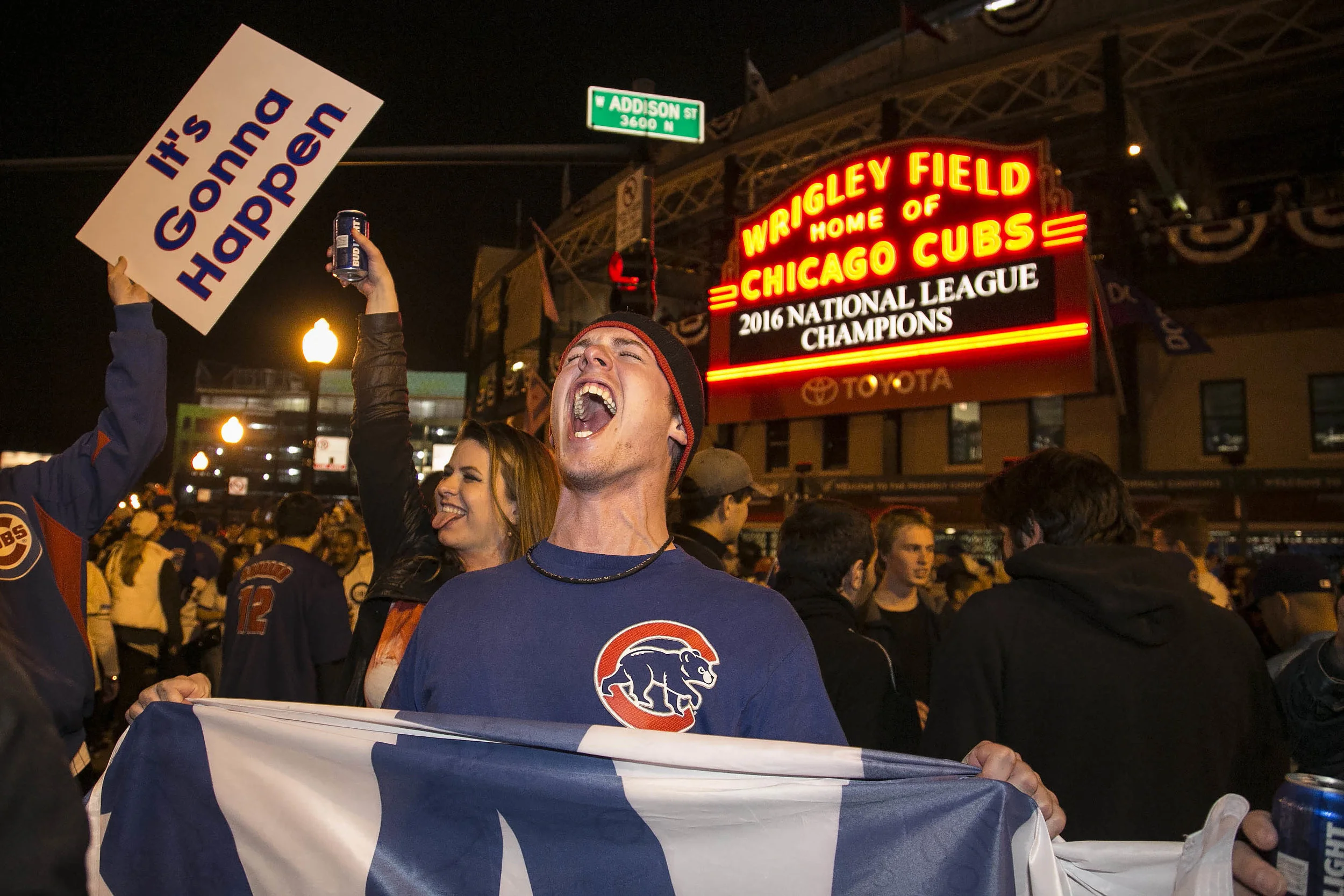  Chicago Cubs fans celebrate outside Wrigley Field after the Cubs defeated the Los Angeles Dodgers 5-0 in Game 6 of baseball's National League Championship Series, Saturday, Oct. 22, 2016. The Cubs advanced to the World Series and beat the Cleveland 