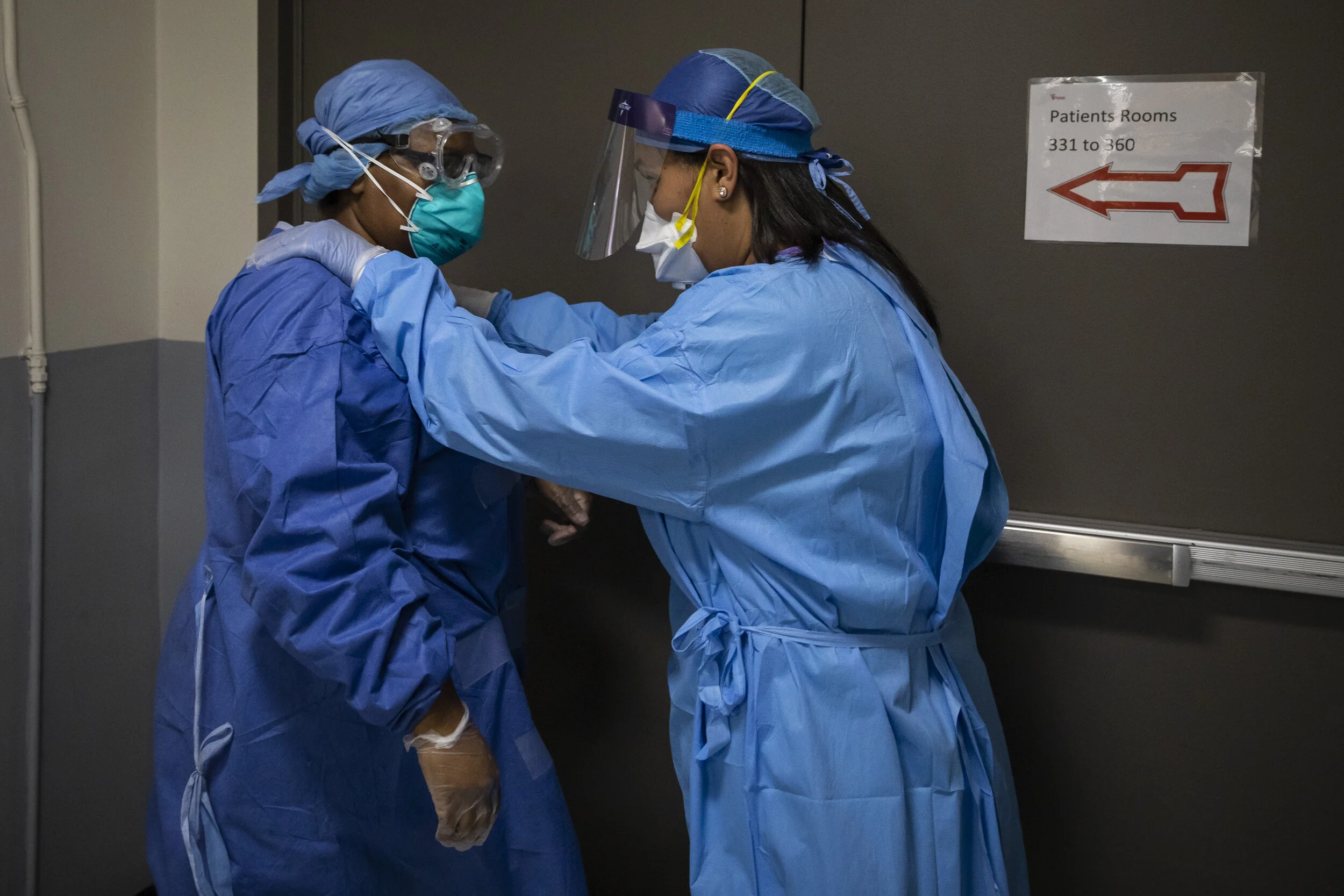  Nurse practitioner Capri Reese gives a pep-talk to nurse Tamara Jones after a 56-year-old woman in the COVID-19 unit prompted a rapid response, meaning respiratory or cardiac arrest, at Roseland Community Hospital on the Far South Side, Tuesday afte