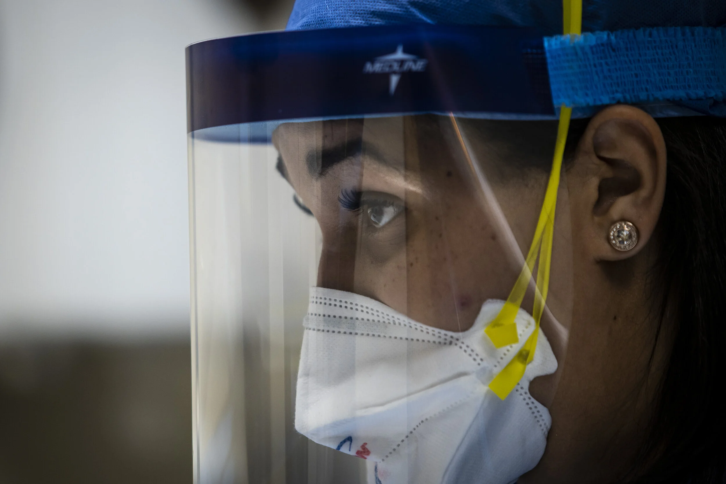  Nurse practitioner Capri Reese talks to a patient while a doctor administers an IV at Roseland Community Hospital on the Far South Side, Tuesday afternoon, April 28, 2020.   During Reese’s standard 12-hour shift Tuesday, she responded to five medica
