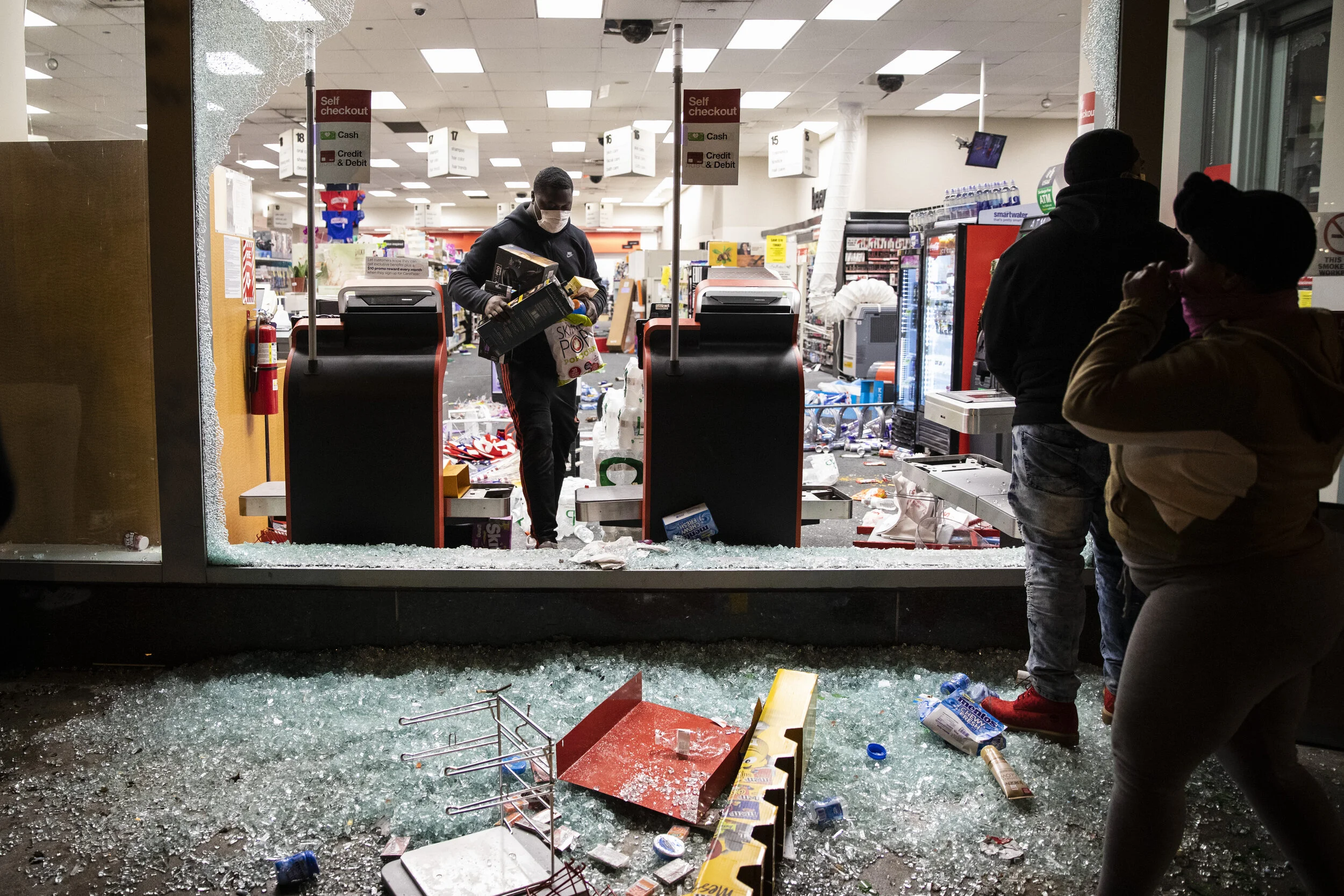  Looters take items from a CVS store at 121 W. Kinzie St. in the River North neighborhood when looting and rioting broke out after thousands of Black Lives Matter protesters and others in Chicago joined national outrage over the killing of George Flo