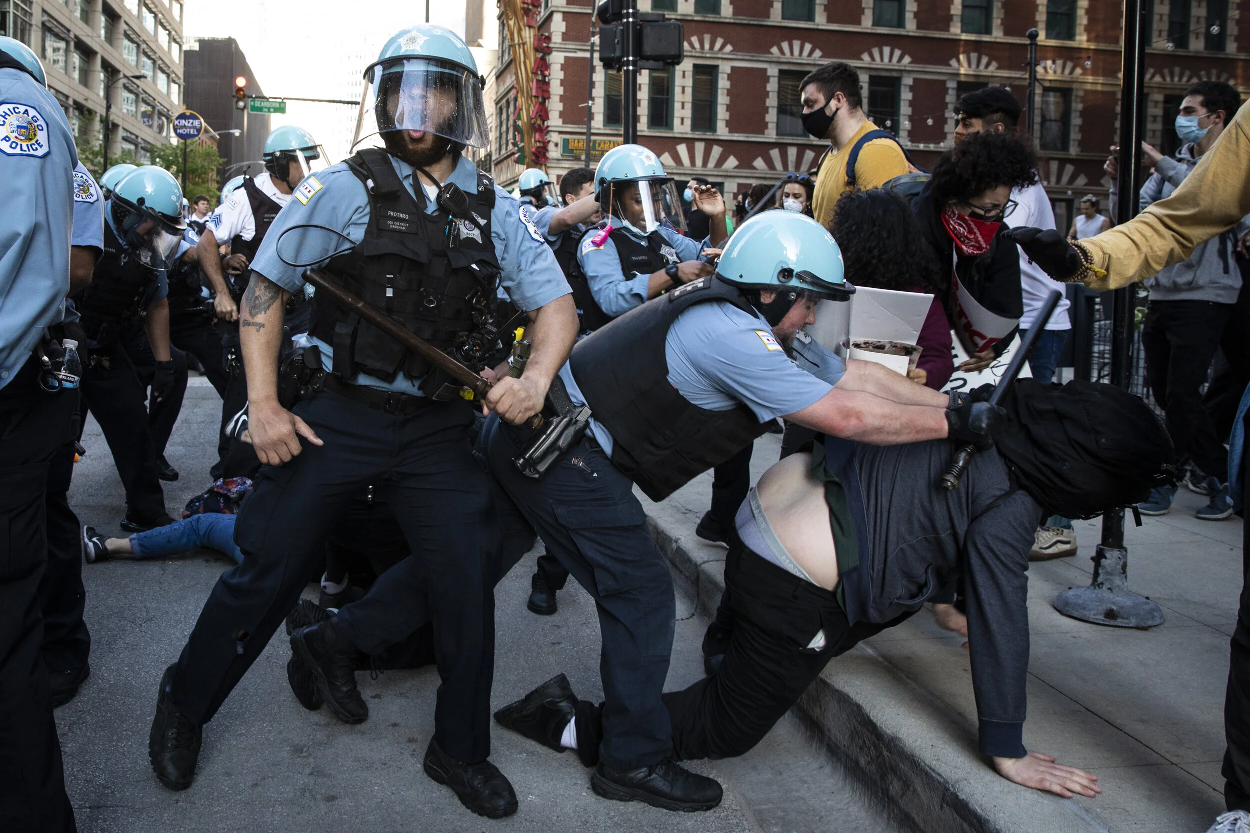 Chicago police officers clash with protesters near West Kinzie and North State streets as thousands in Chicago joined national outrage over the killing of George Floyd in Minneapolis police custody, Saturday afternoon, May 30, 2020. | Ashlee Rezin/S