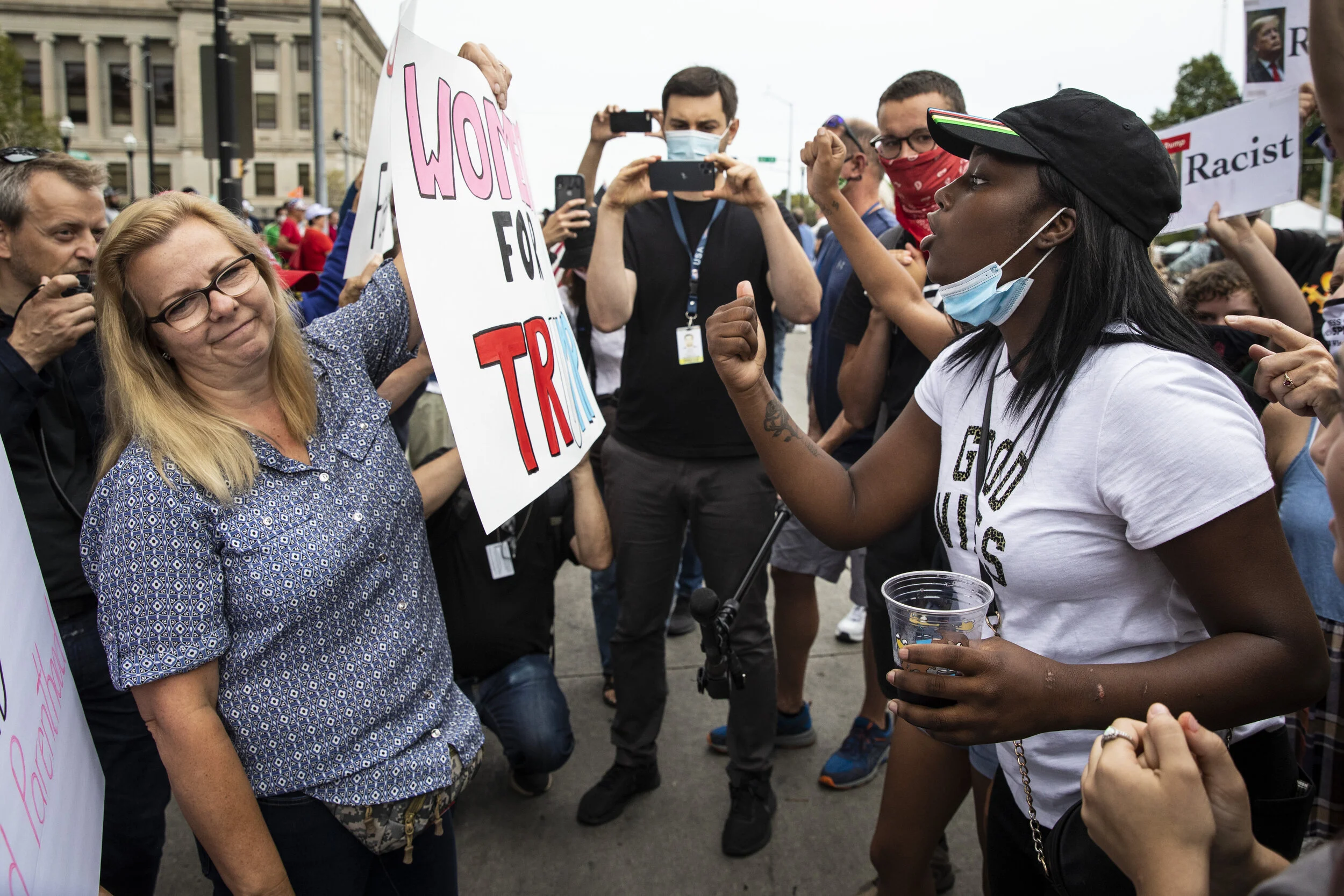  Supporters of President Donald Trump and Black Lives Matter protesters argue and shout over each other outside of the Kenosha County Courthouse, in anticipation of the president's arrival in the Wisconsin city, Tuesday afternoon, Sept. 1, 2020. | As