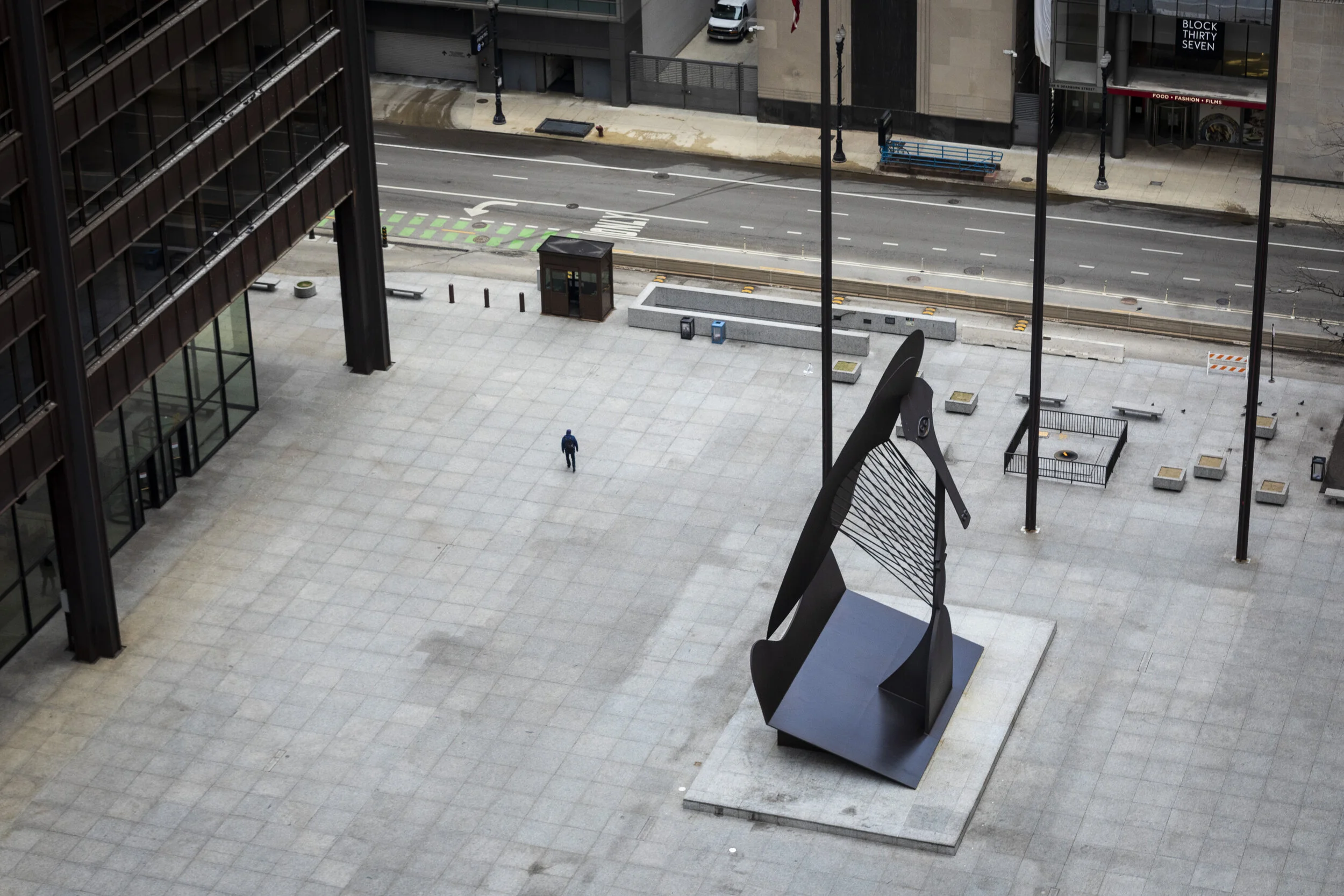  Amid fears of the coronavirus pandemic and a stay-at-home order from Illinois Gov. J.B. Pritzker, a man has Daley Plaza to himself as he walks through the Loop during a usually bustling Wednesday morning commute in Chicago, April 1, 2020.   To help 
