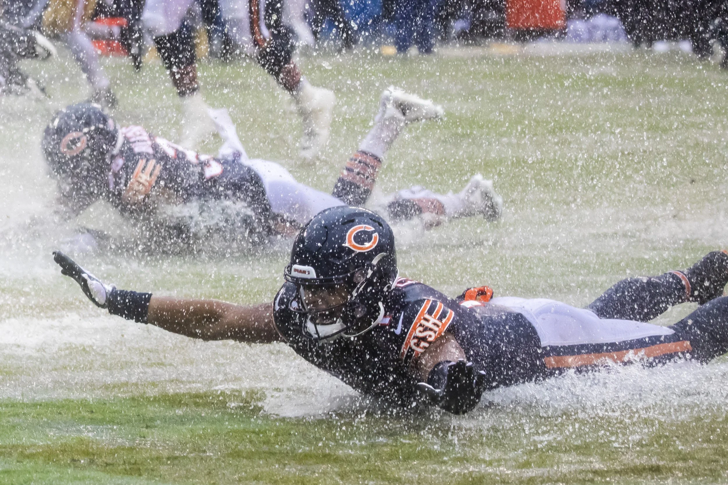  Chicago Bears quarterback Justin Fields #1 celebrates after the Bears beat the San Francisco 49ers, 19 - 10, at Soldier Field, Sunday afternoon, Sept. 11, 2022. | Ashlee Rezin/Sun-Times    Bears celebrate rainy-day win with victory slide into the en