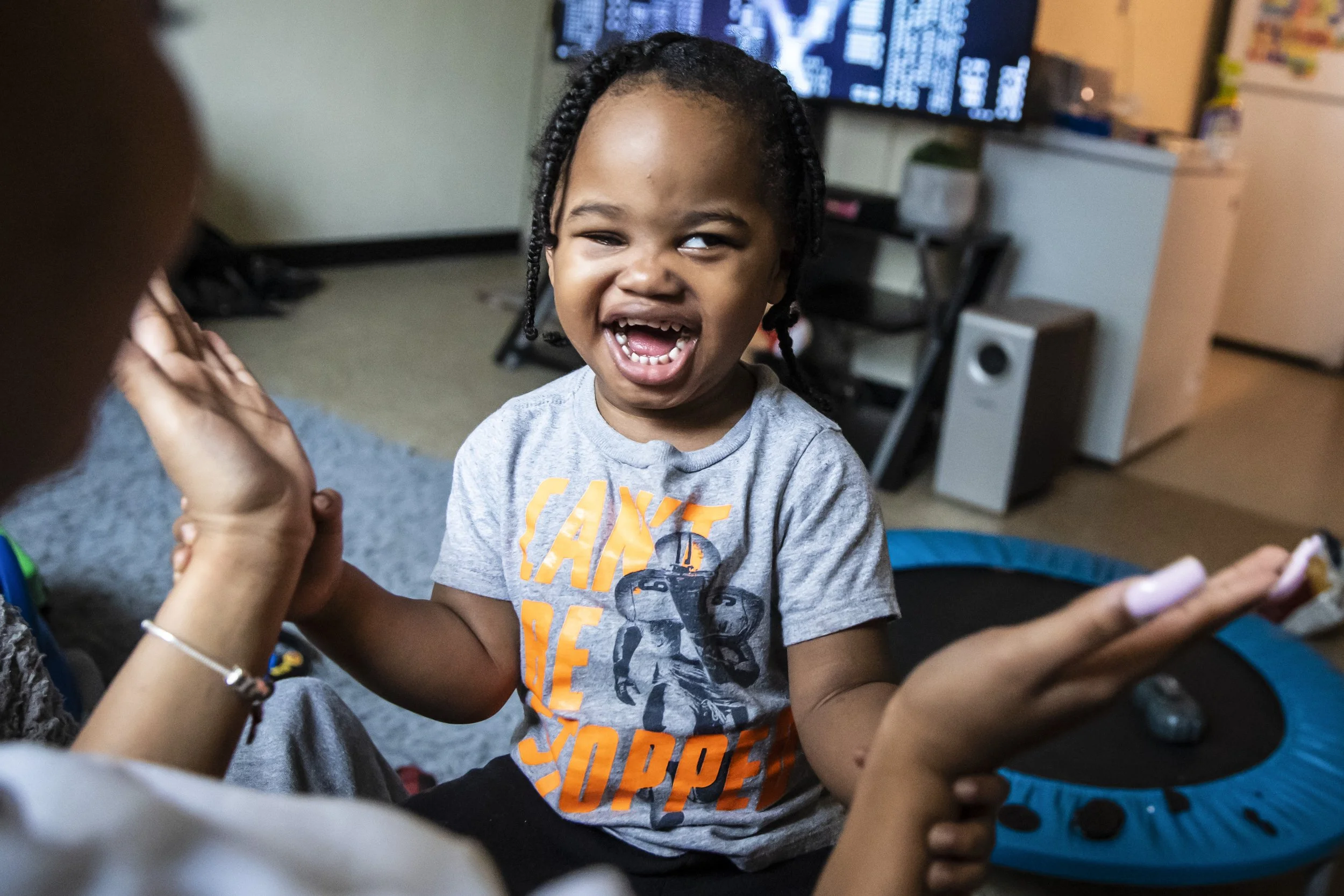  Jalisa Hooks, 21, plays with her 2-year-old son, Kayden Swann, in the family's South Chicago neighborhood apartment on the South Side, Tuesday morning, March 1, 2022.  Kayden is blind in his right eye after he was shot in the head on April 6, 2021, 