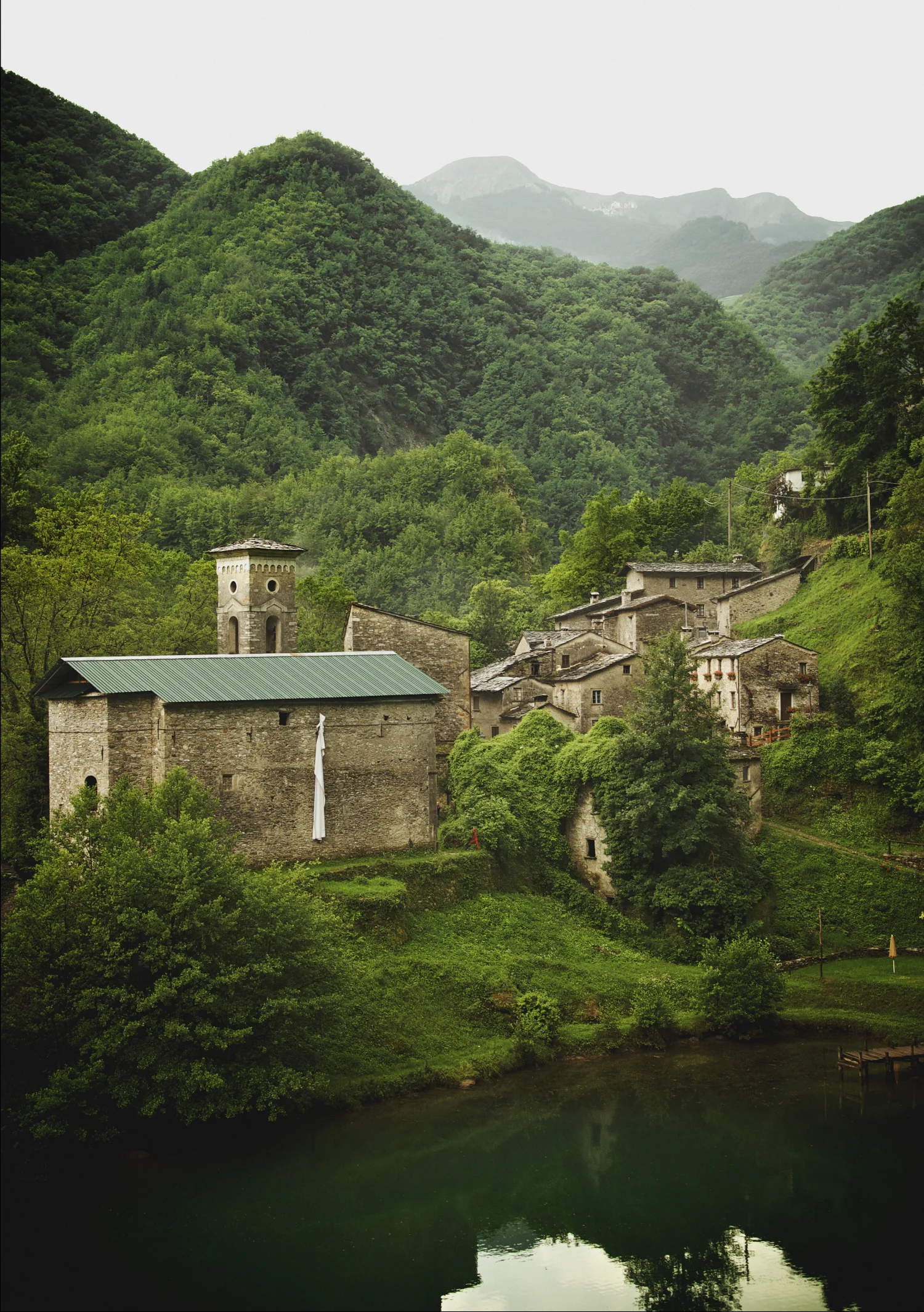Green mineral water forest village Apennine Mountains Italy