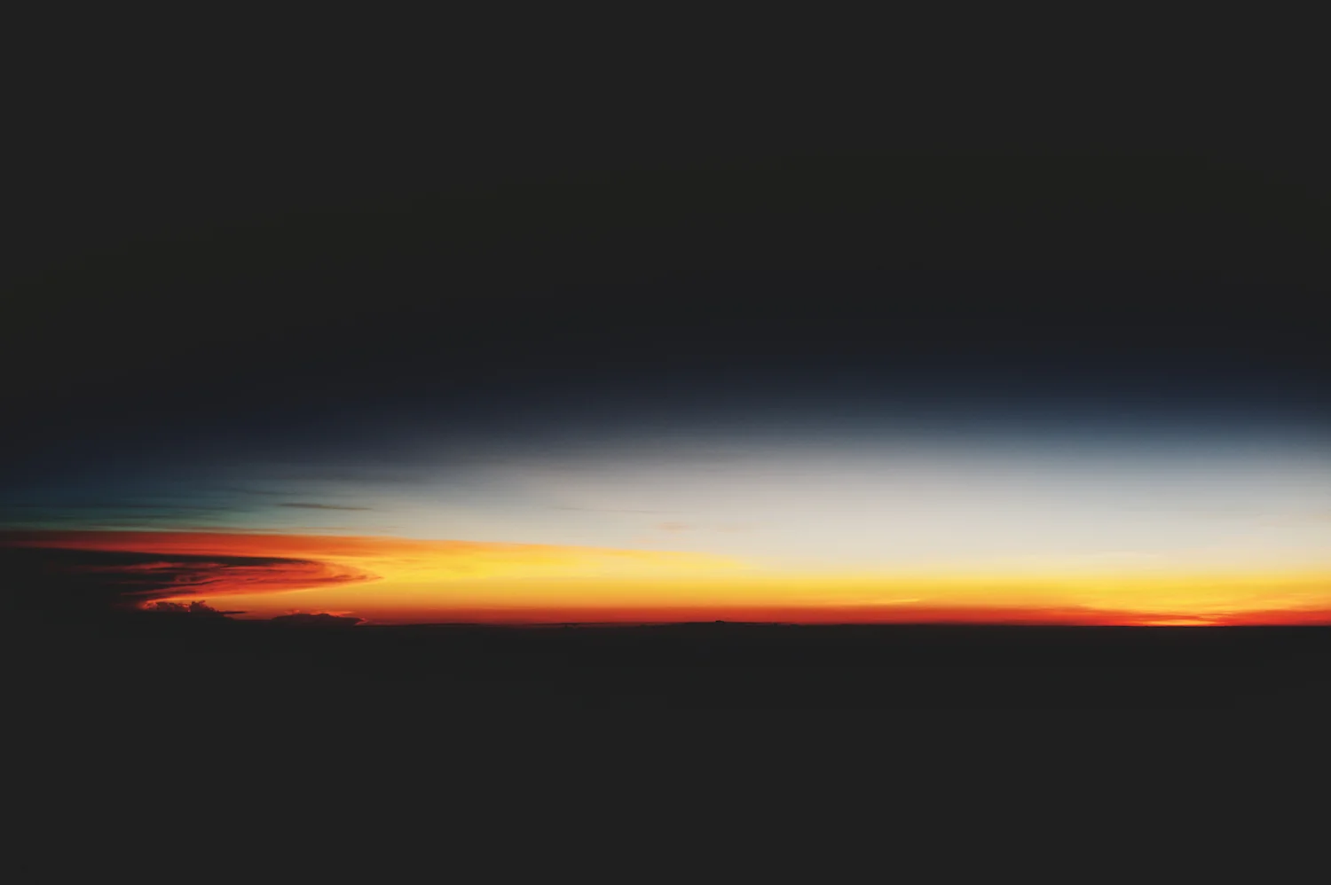 Stunning sunrise over Pacific Ocean from plane to Rarotonga Cook Islands