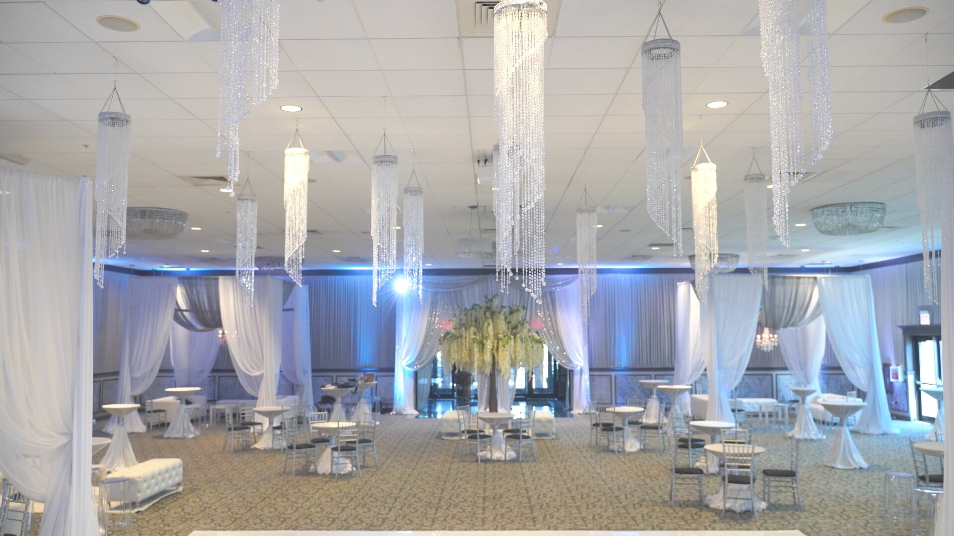 Crystal+spiral+chandeliers+wedding+ceiling+luxury+instalation+crystal+chanderliers+over+white+dance+floor+chicago+rental.jpg