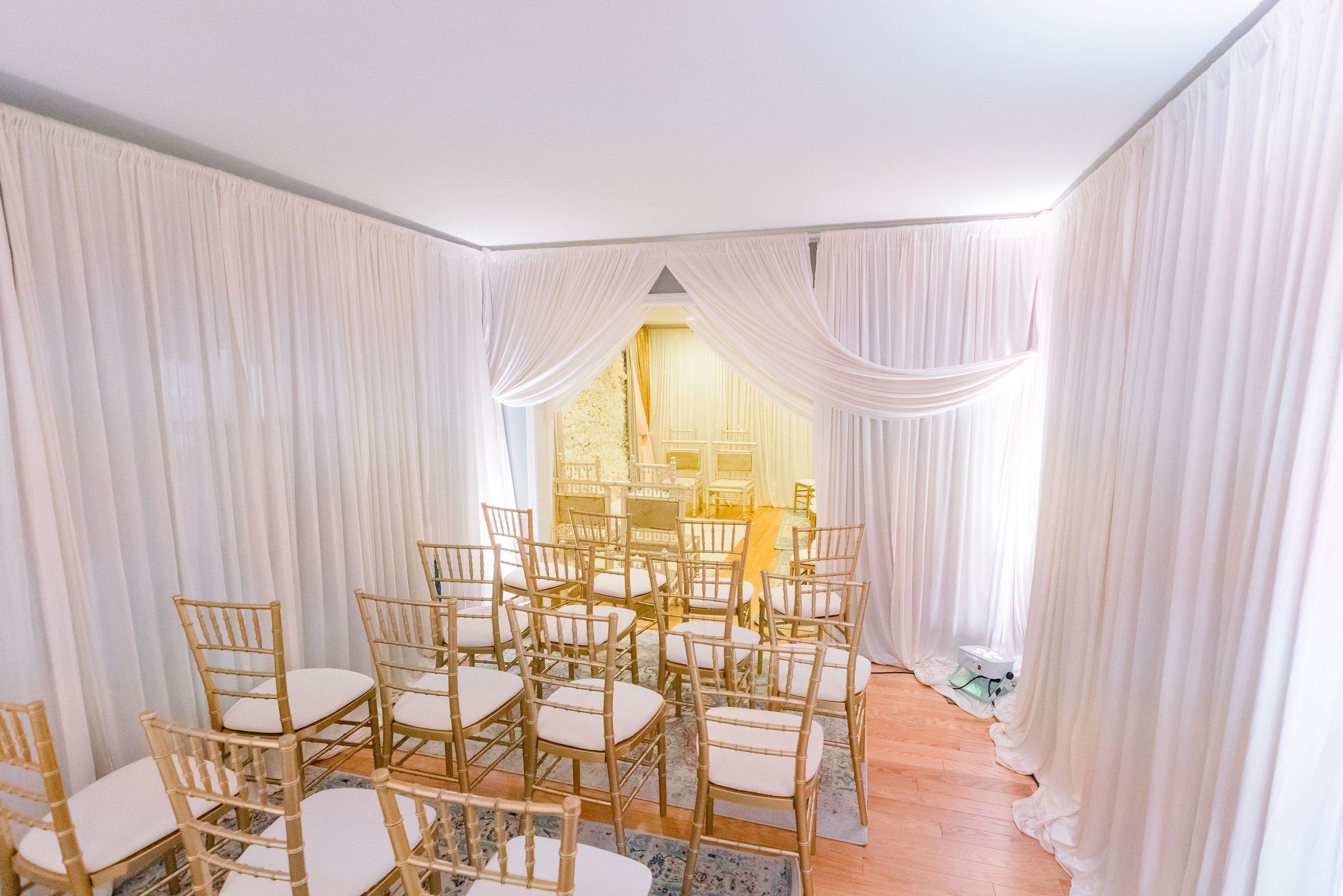 Basement wall draping wedding in the living room garage wall draping intimate wedding at home micro wedding event in chicago chiavari chairs table ren (6).jpg
