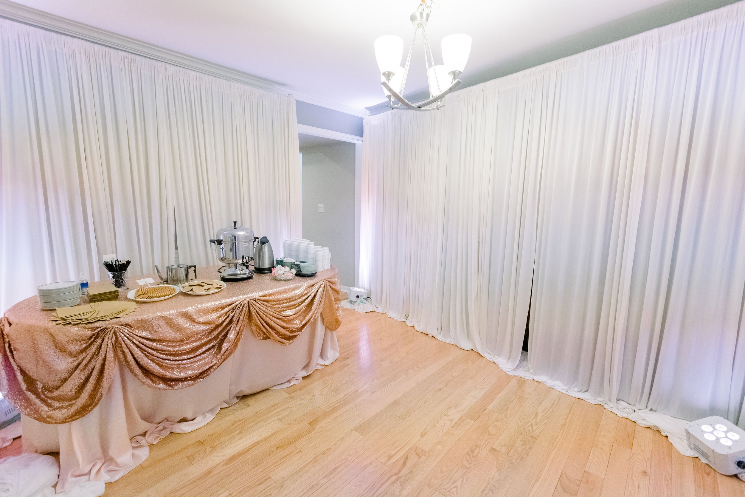 Basement wall draping wedding in the living room garage wall draping intimate wedding at home micro wedding event in chicago chiavari chairs table ren (9).jpg