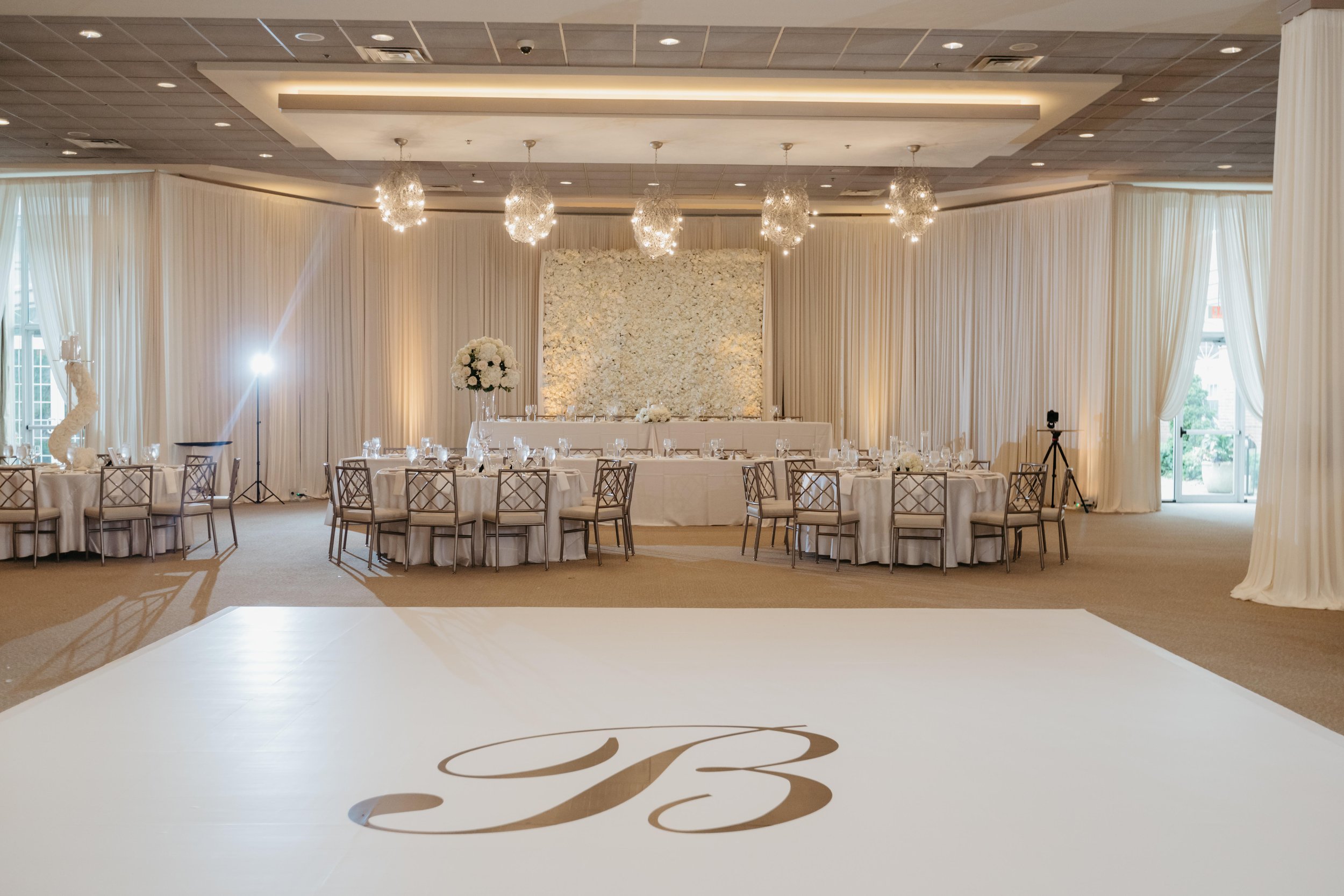 belvedere wedding decoration white dance floor cover chicago satin chair best luxury wedding decorator white floral wall printed initials on the dance floor naperville (4).jpg