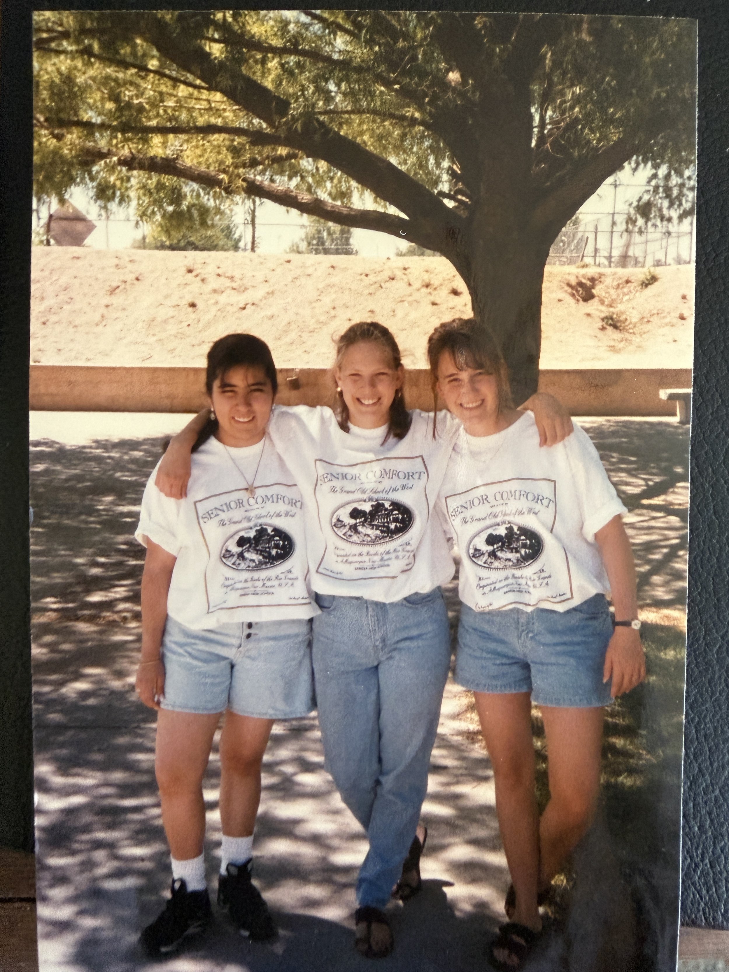 Jennie Bennett as a teenager with two friends wearing matching Senior Comfort t-shirts, New Mexico